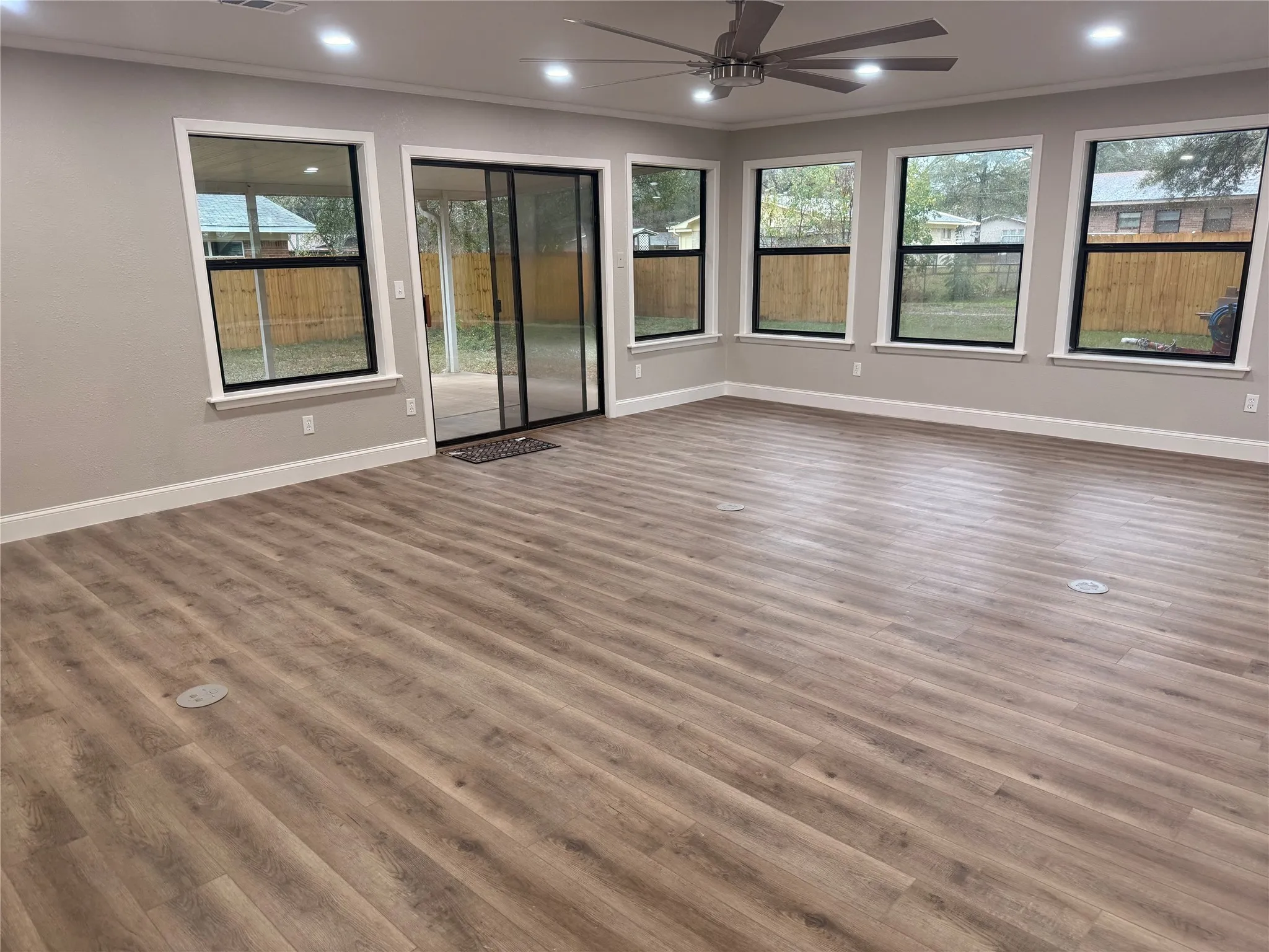 Spare room with ornamental molding, wood finished floors, recessed lighting, and ceiling fan