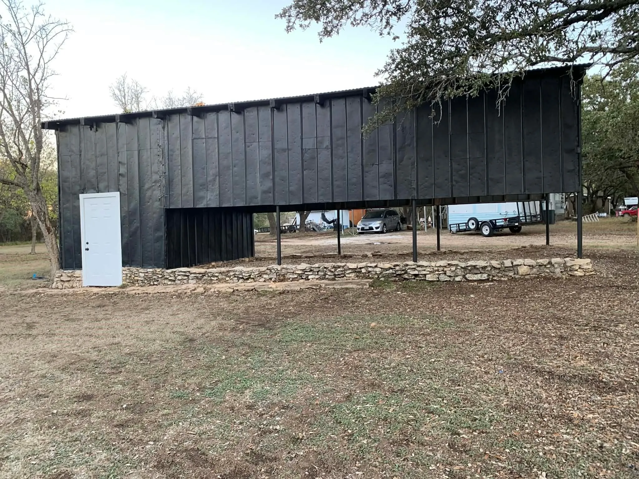 View of outdoor structure featuring a carport