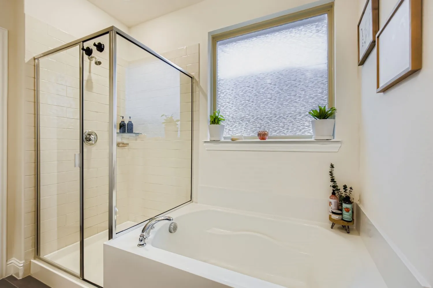 Bathroom featuring a bath and a stall shower