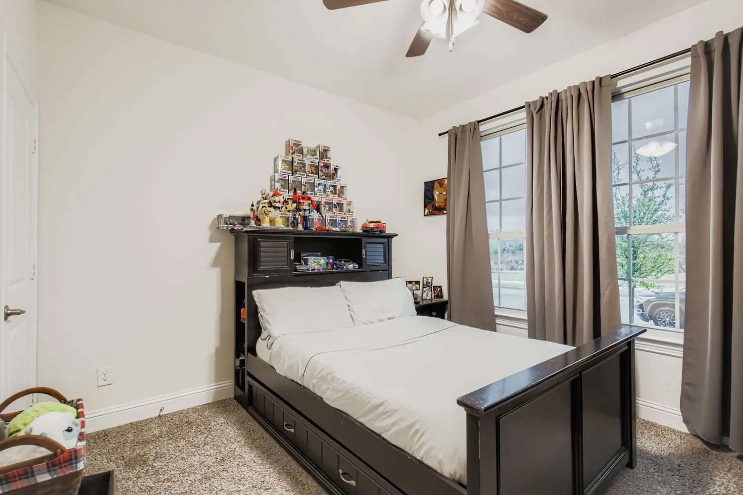 Bedroom featuring ceiling fan and carpet flooring