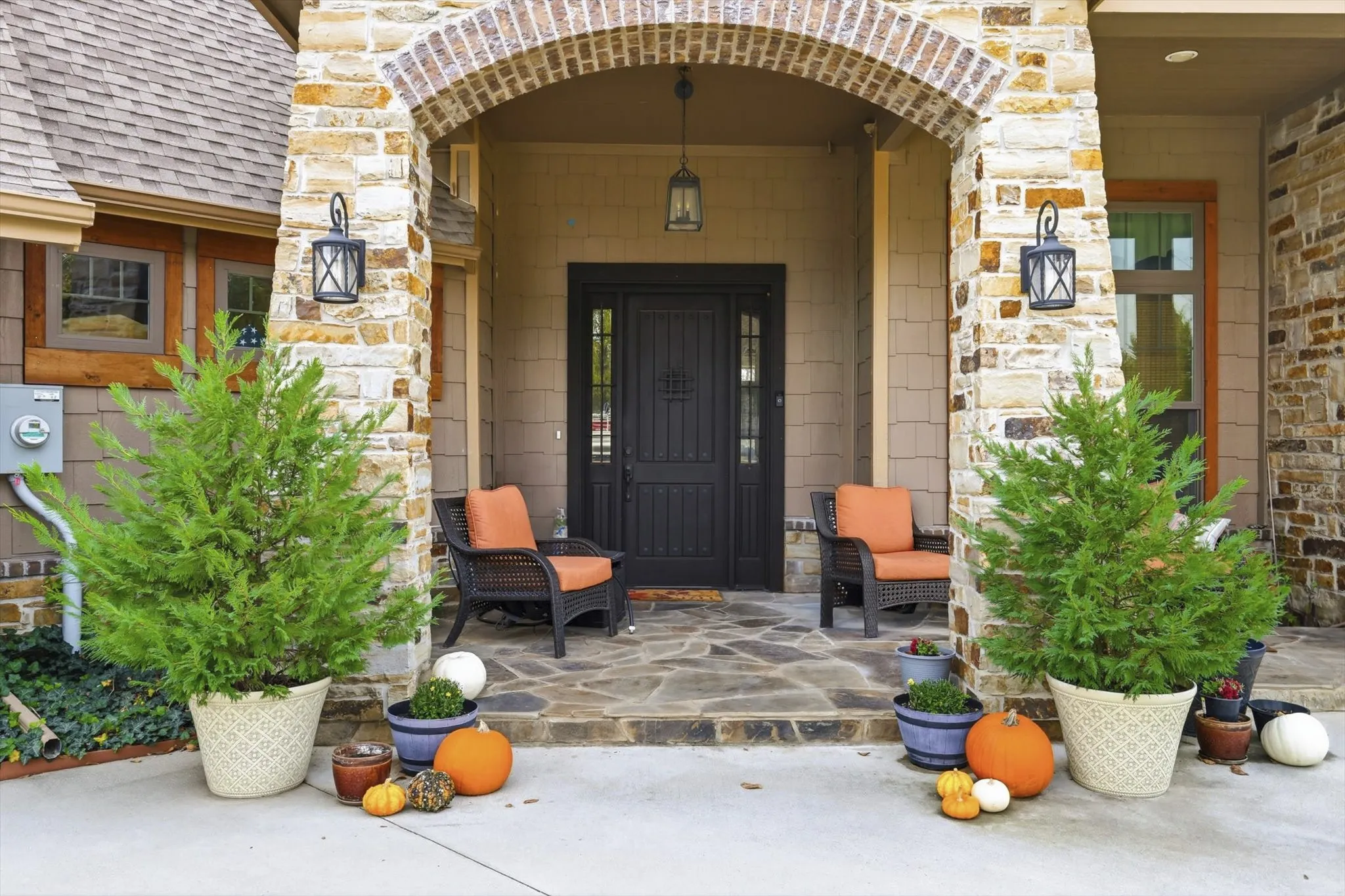 Entrance to property with stone siding