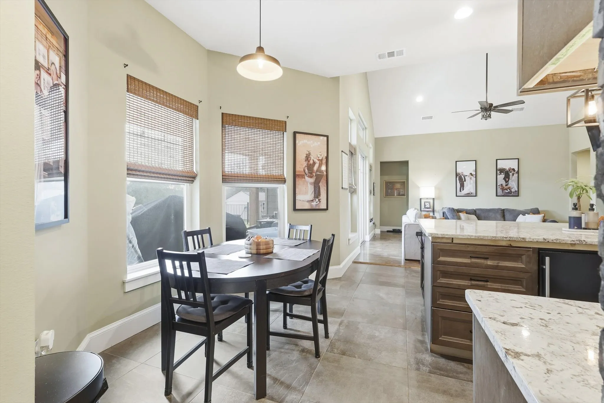 Dining area featuring a high ceiling, a ceiling fan, and recessed lighting