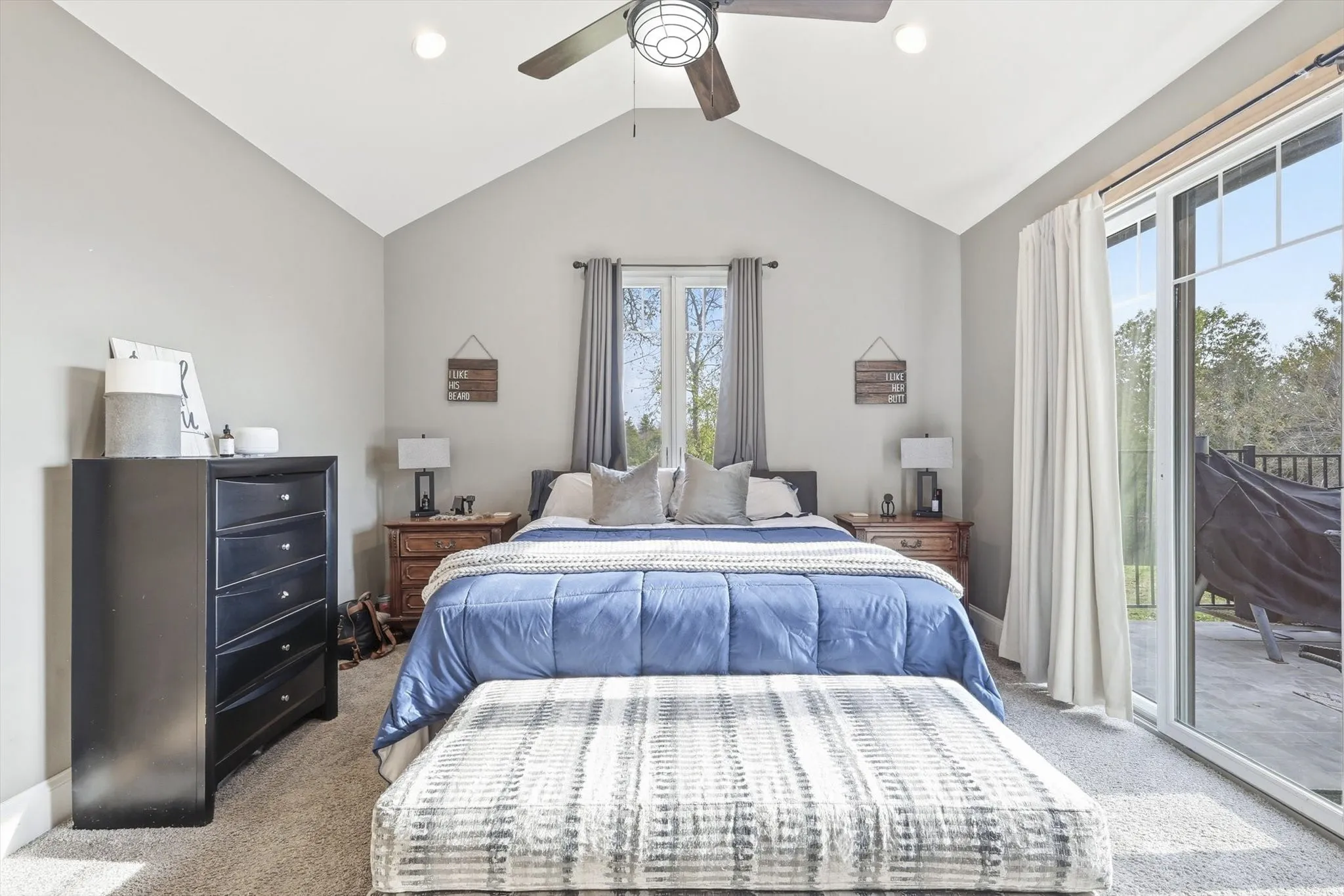 Bedroom featuring access to outside, vaulted ceiling, carpet, and a ceiling fan