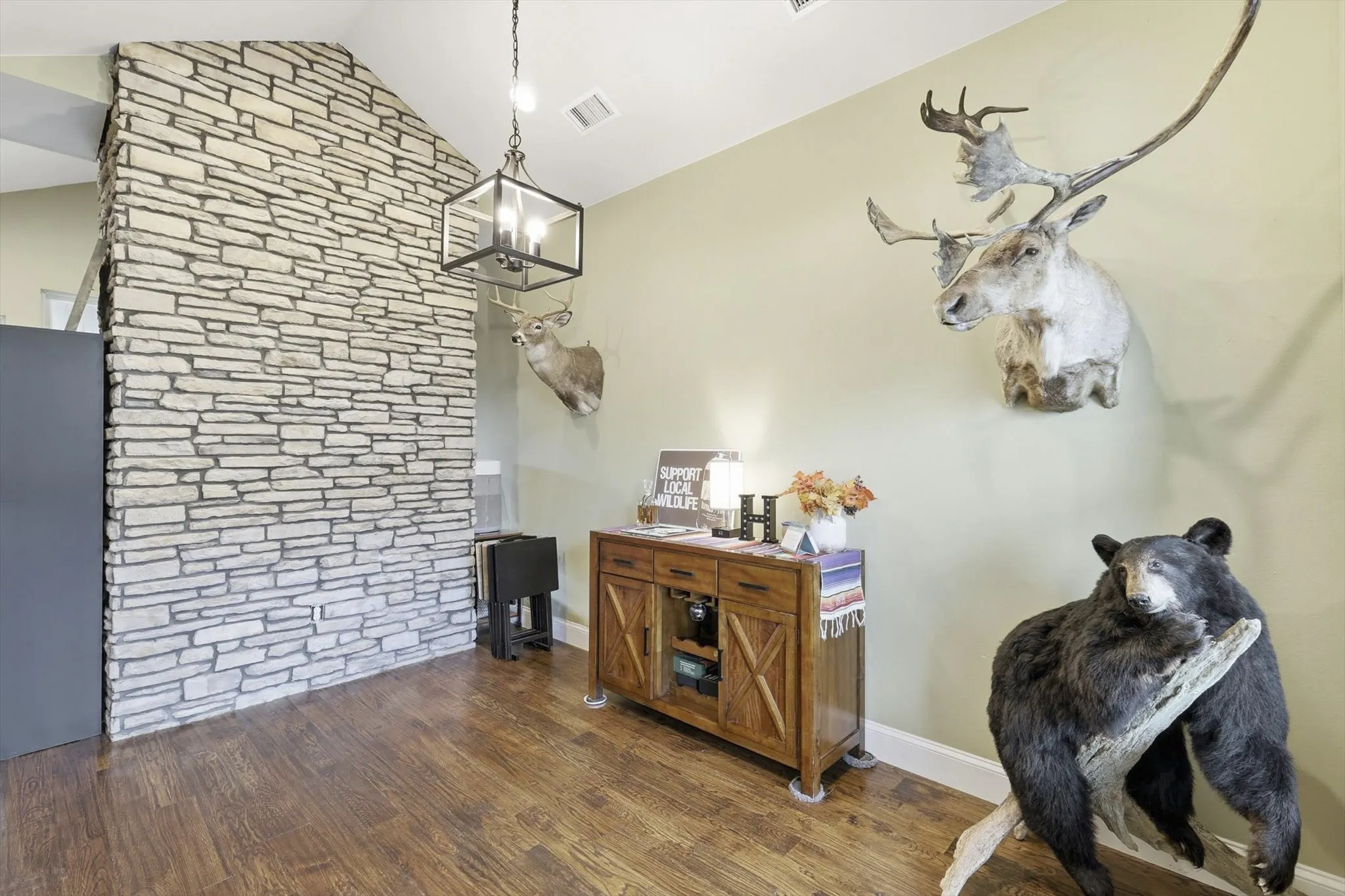 Dining area featuring dark wood finished floors and lofted ceiling