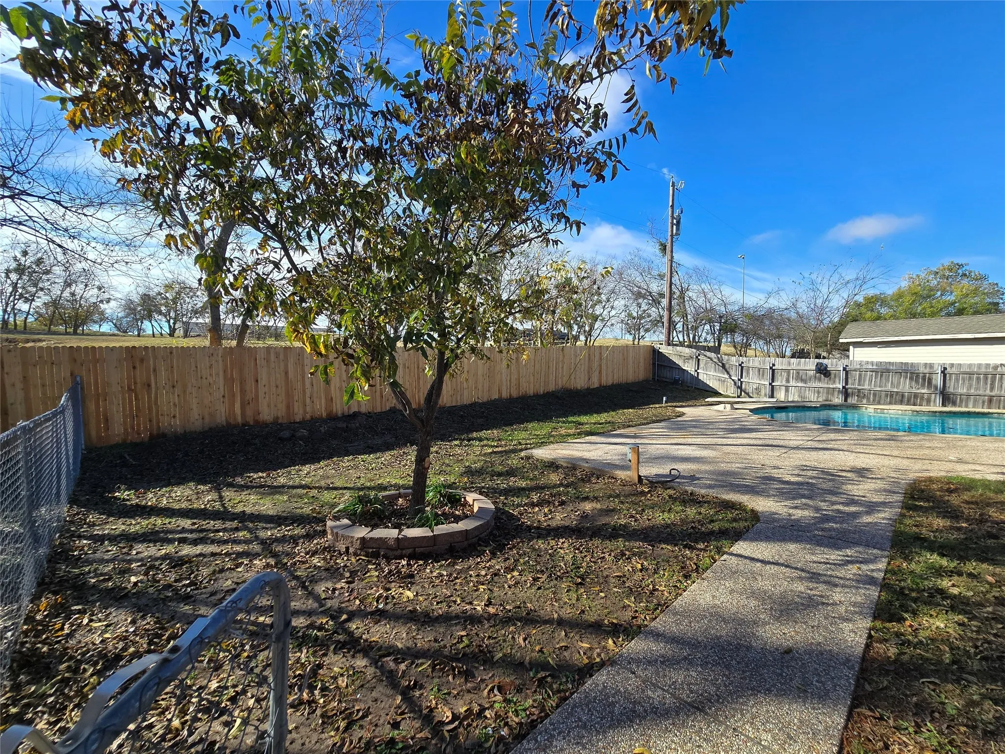 Fenced backyard featuring a patio area