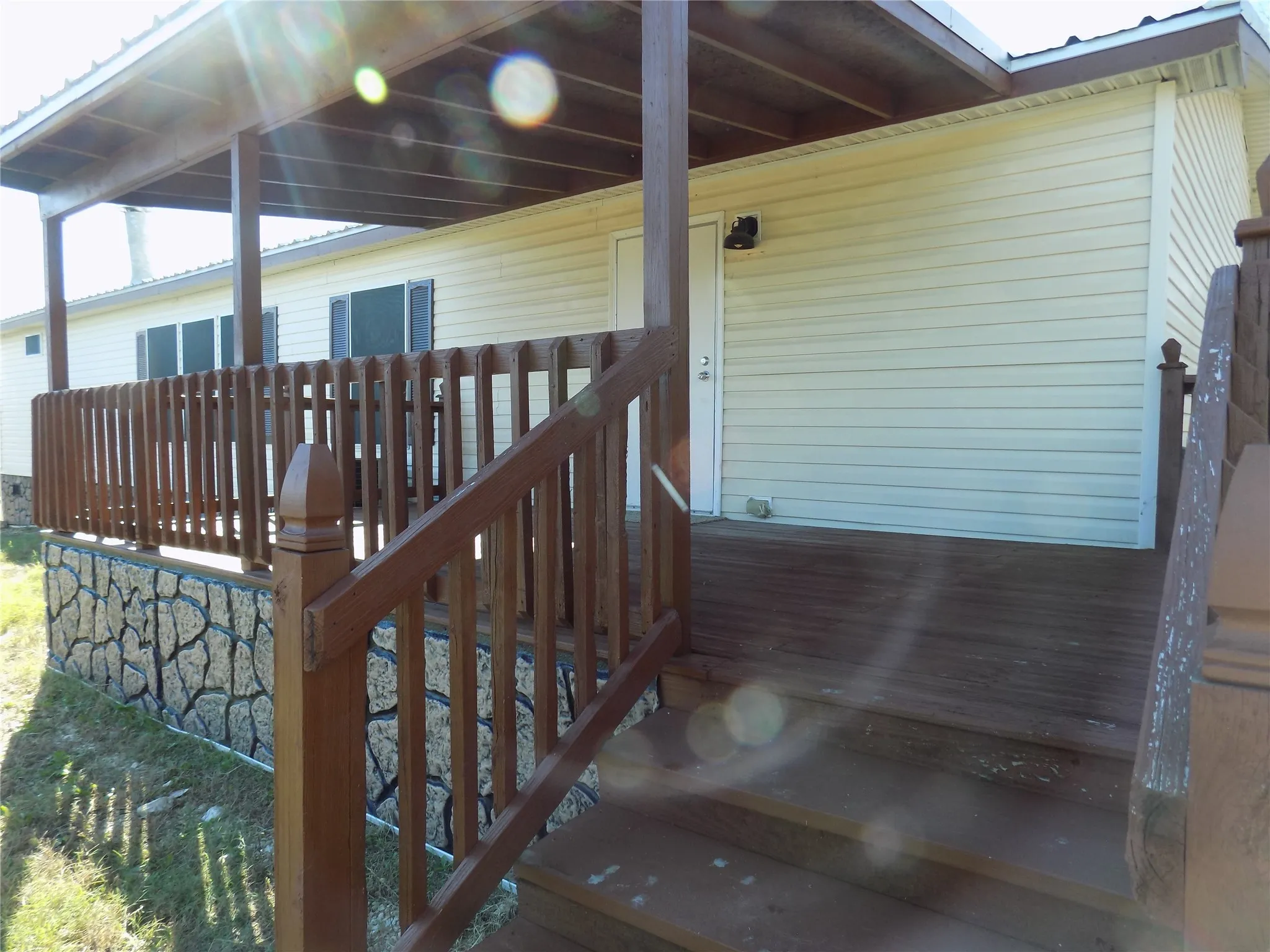 Absolutely wonderful back door area with cover and large deck.