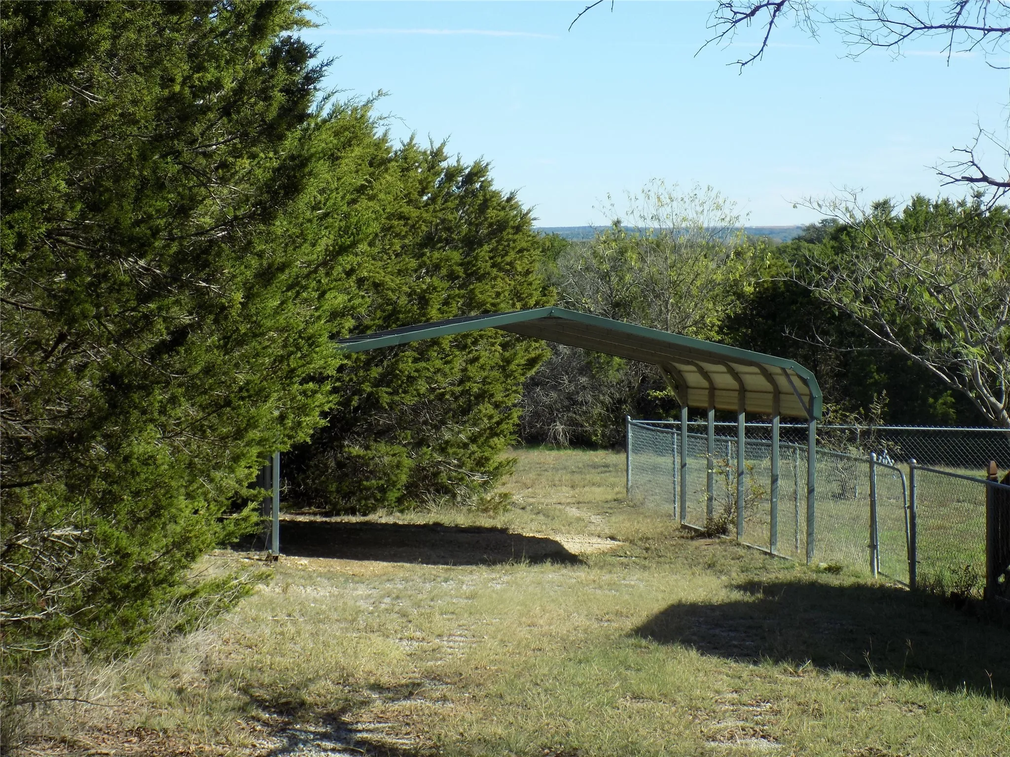 View of yard with carport.