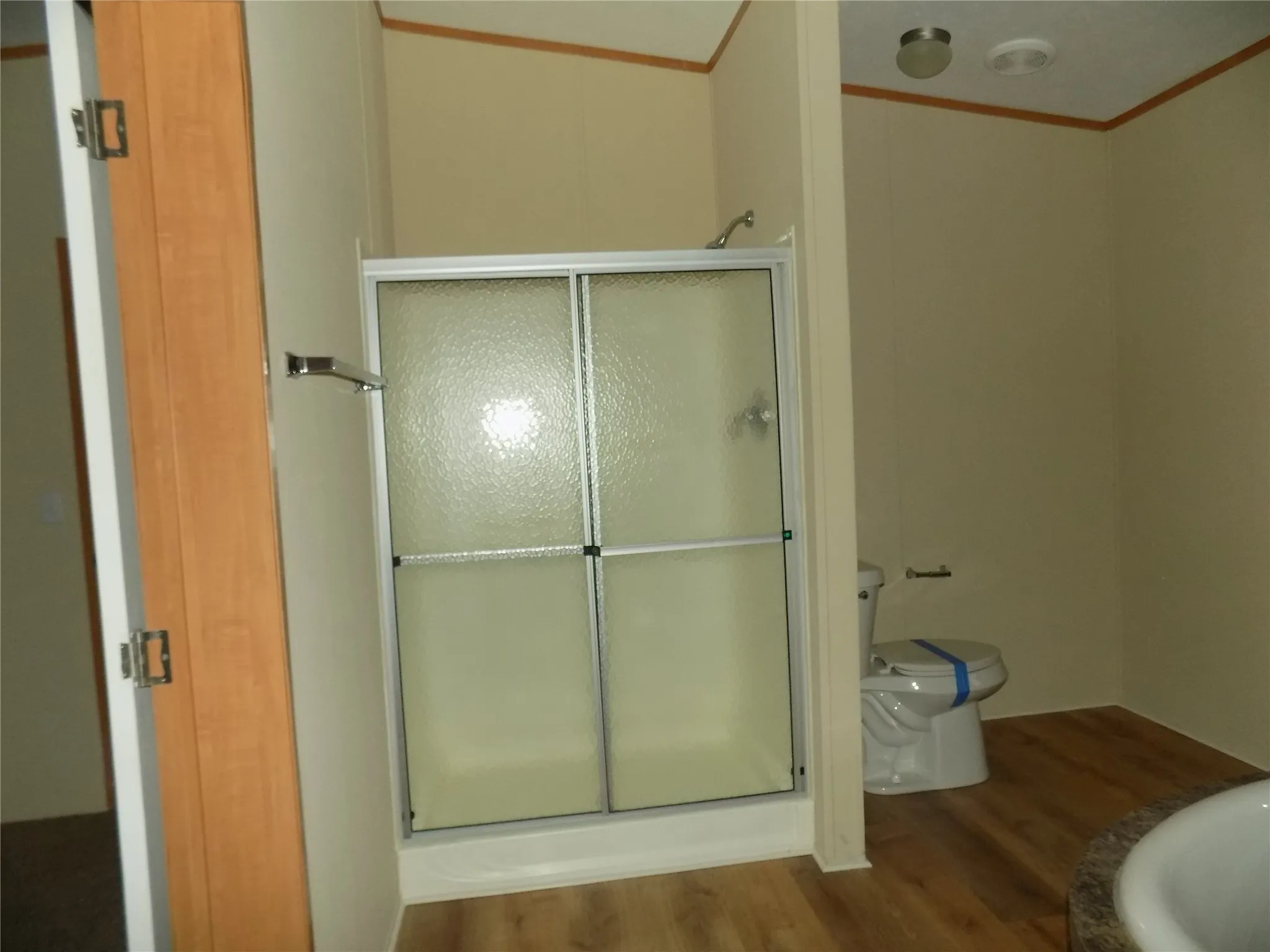 Primary bathroom with separate shower in spacious bath area.