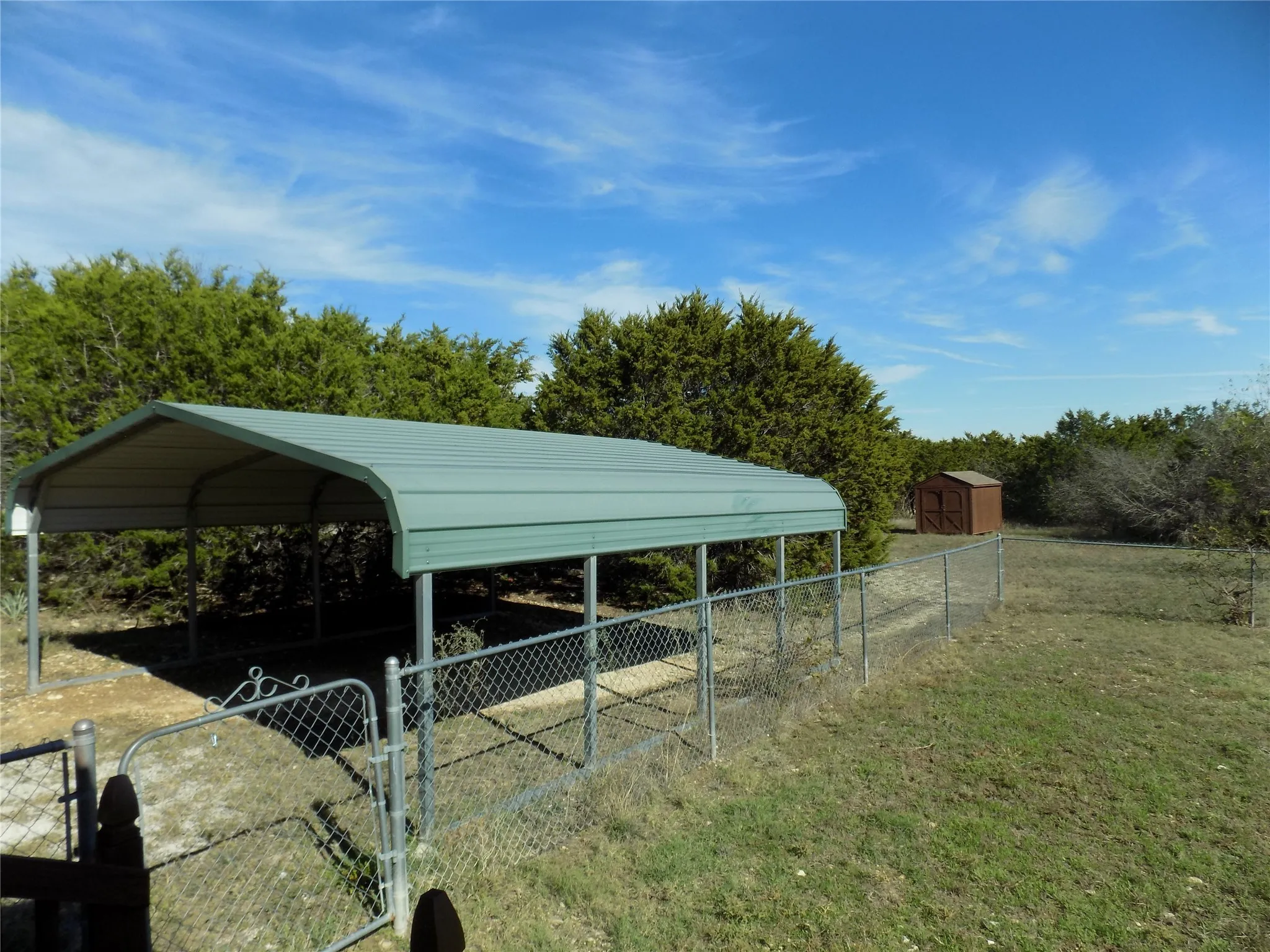 Very nice 2-car carport; notice the beautiful view.