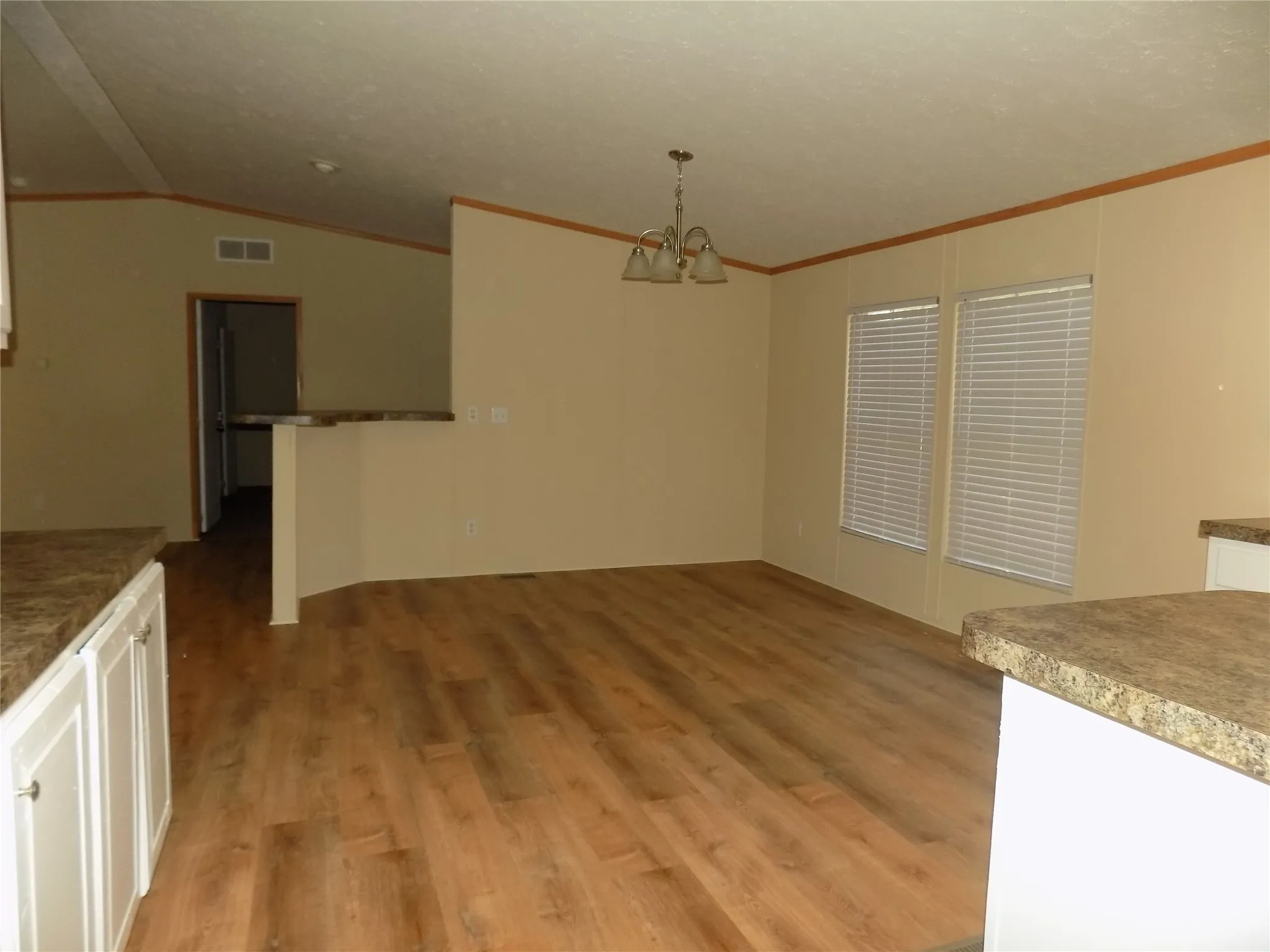 Dining area in full view, warm and accommodating.