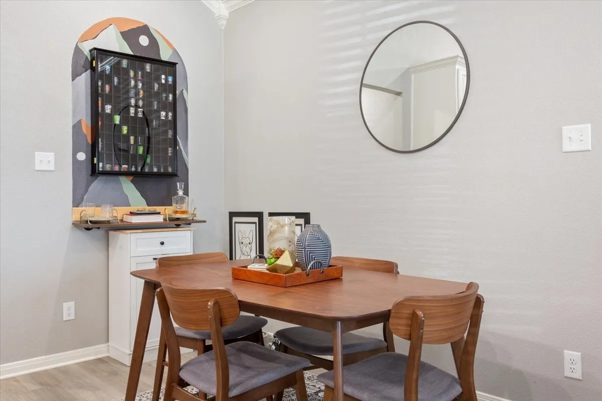 Dining area featuring baseboards and light wood-type flooring