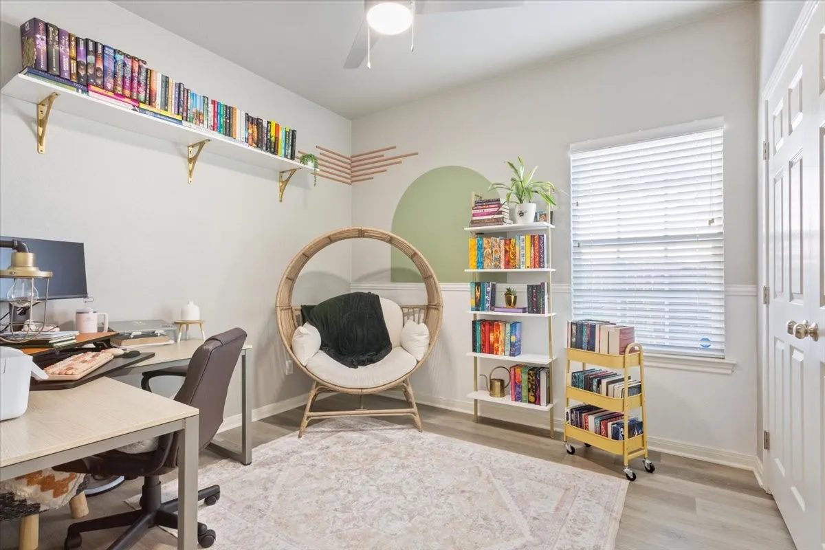 Home office featuring light wood-style floors and ceiling fan