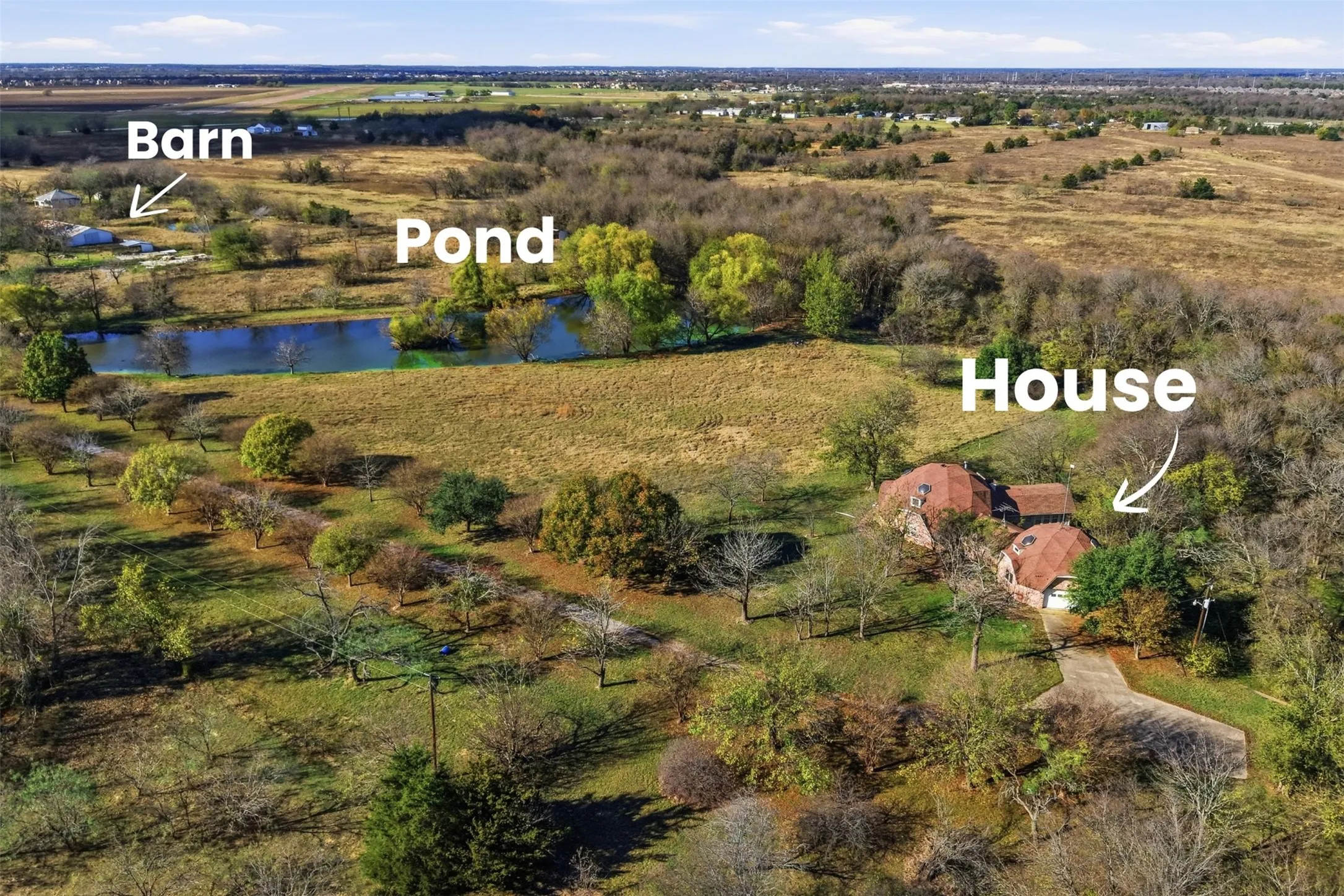 View including home, pond, barn