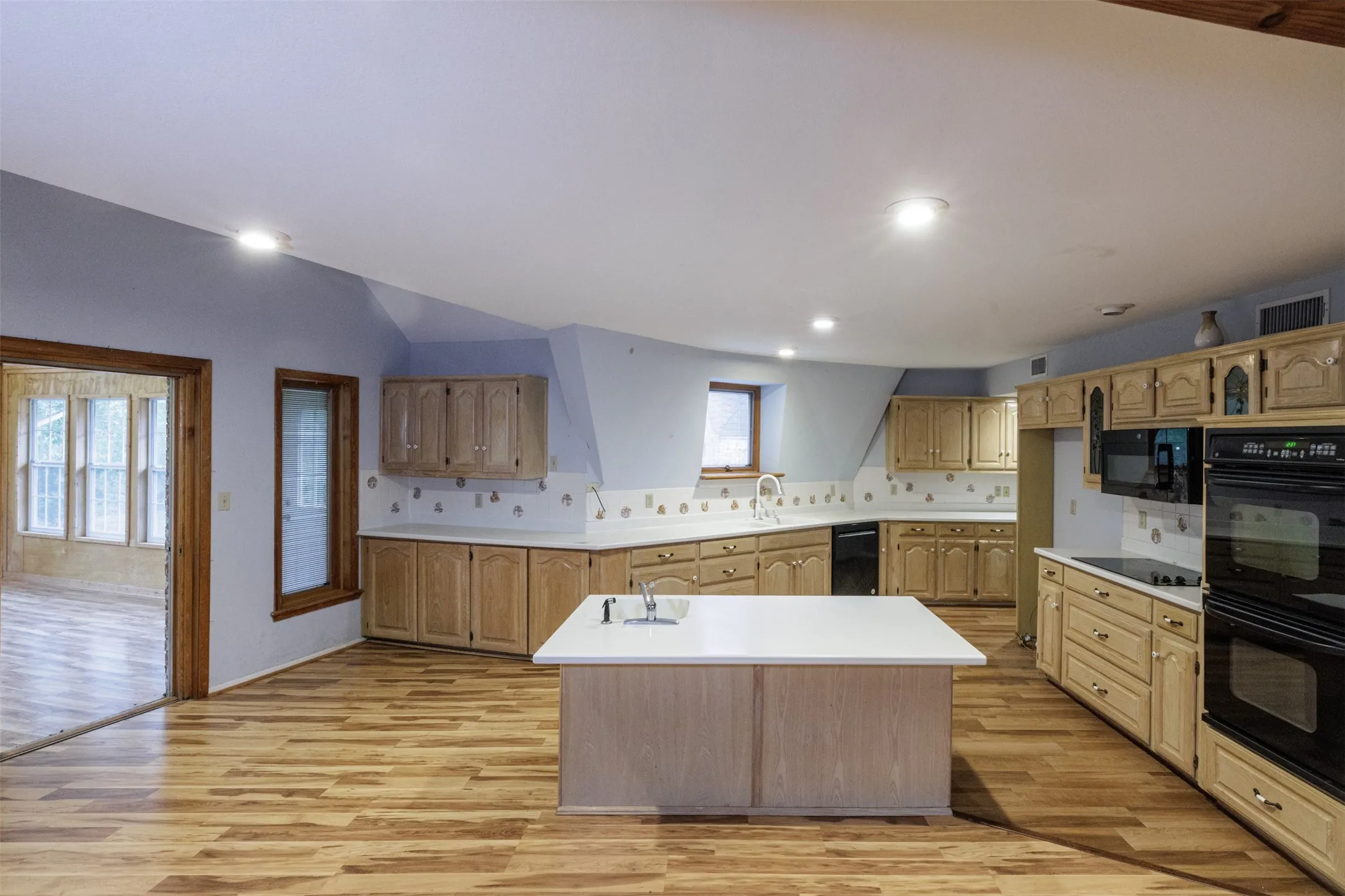 Spacious kitchen with island, tons of cabinets, double ovens and BI microwave