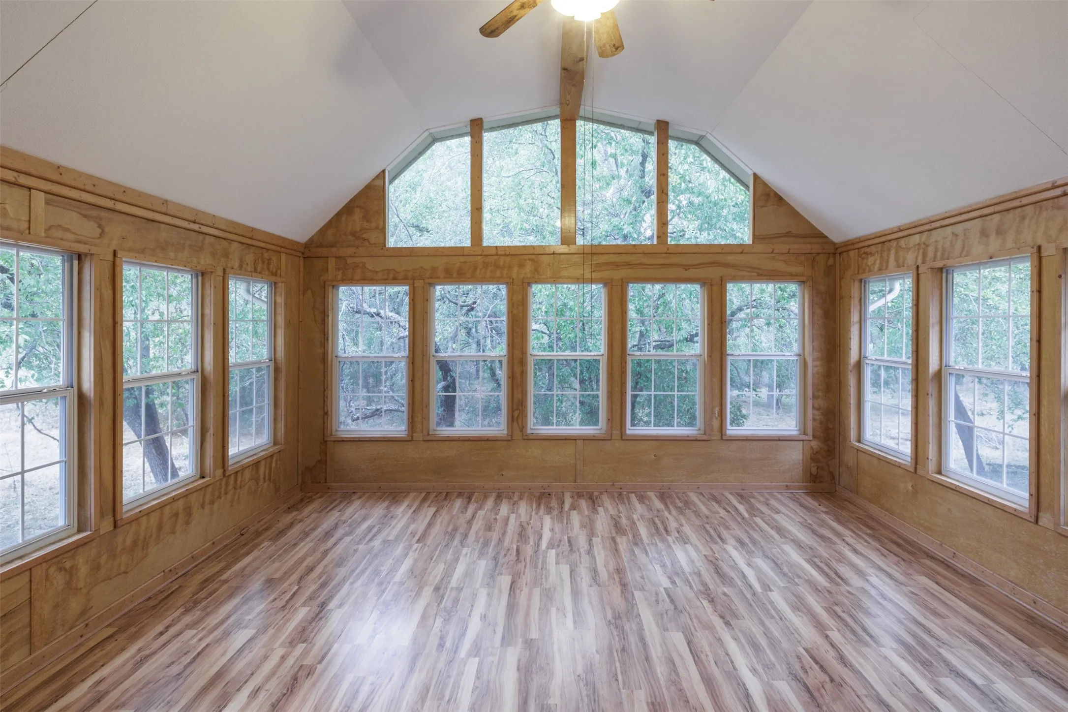 Beautiful sunroom off kitchen with generous windows offering plenty of natural sunlight!