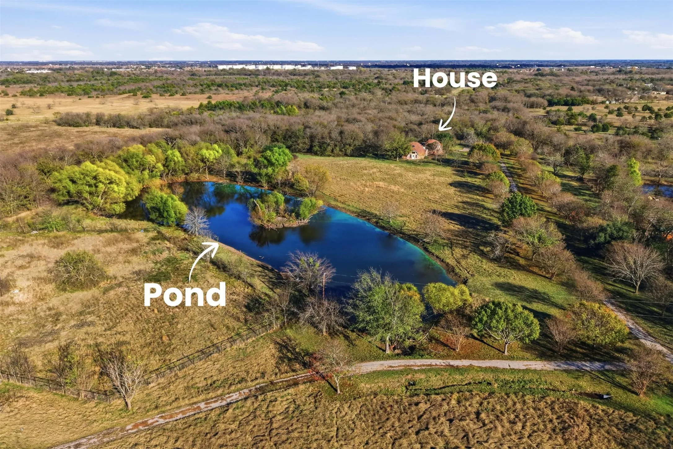 Breathtaking view of large pond, dome home and lovely land
