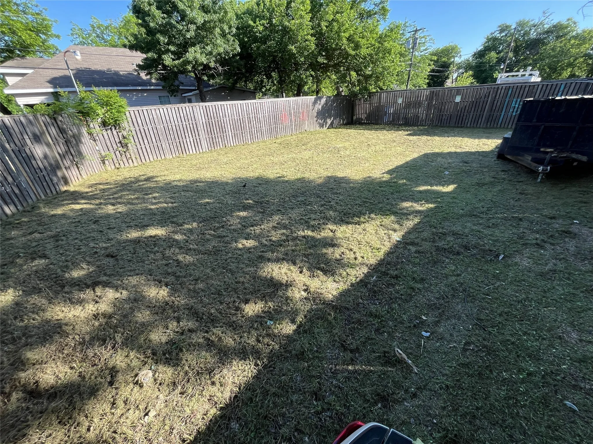 View of fenced backyard