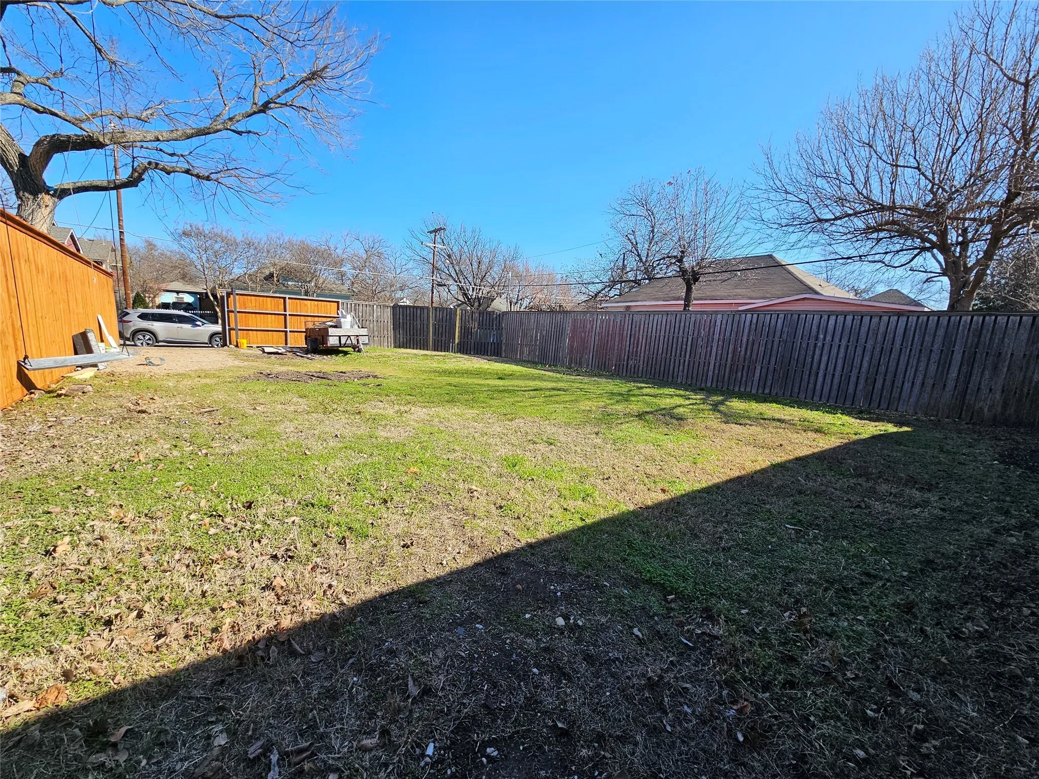 View of fenced backyard