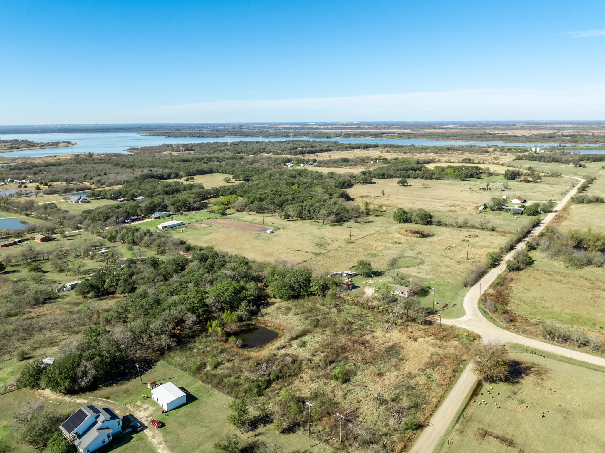 Aerial view of sparsely populated area with a nearby body of water