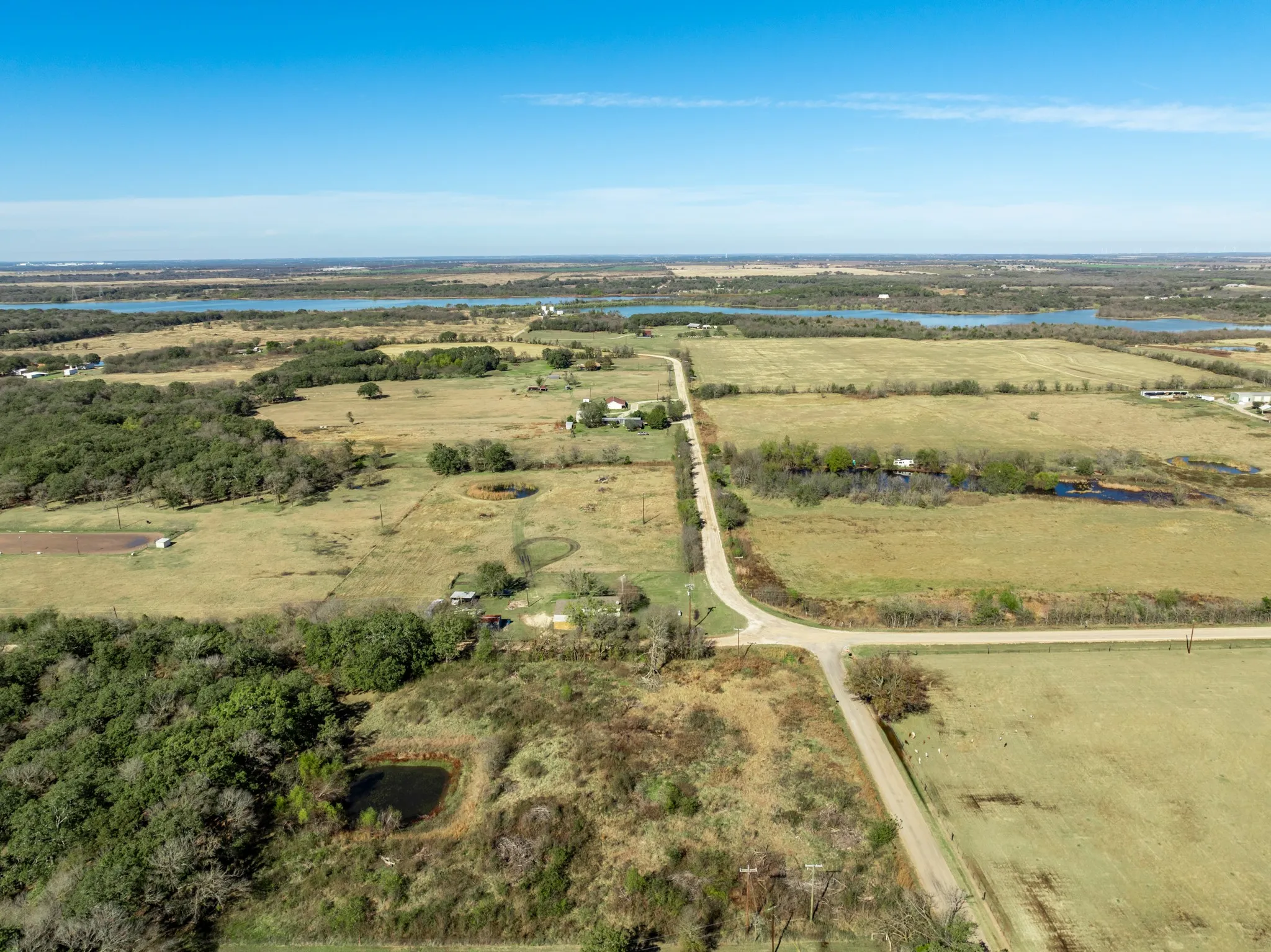Aerial overview of property's location featuring a nearby body of water and rural landscape