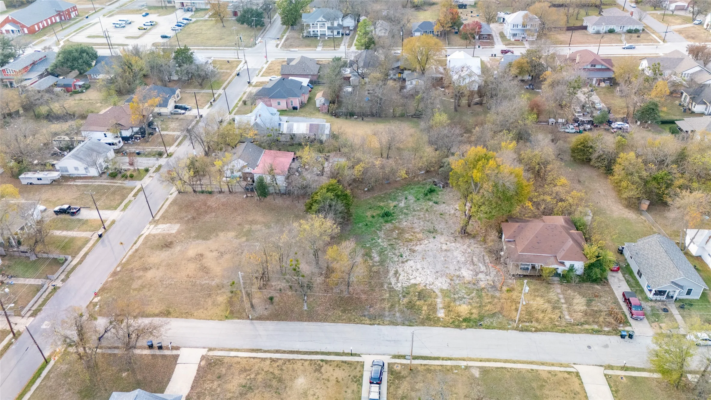 Aerial view of property's location featuring nearby suburban area