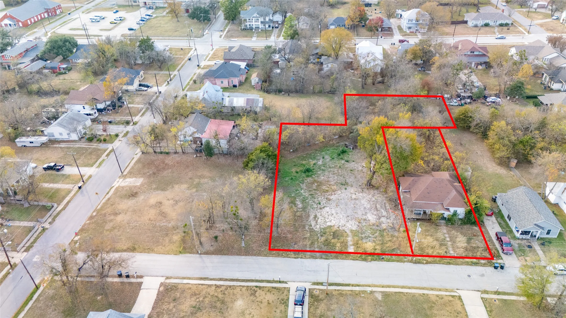 Aerial perspective of suburban area featuring property parcel outlined