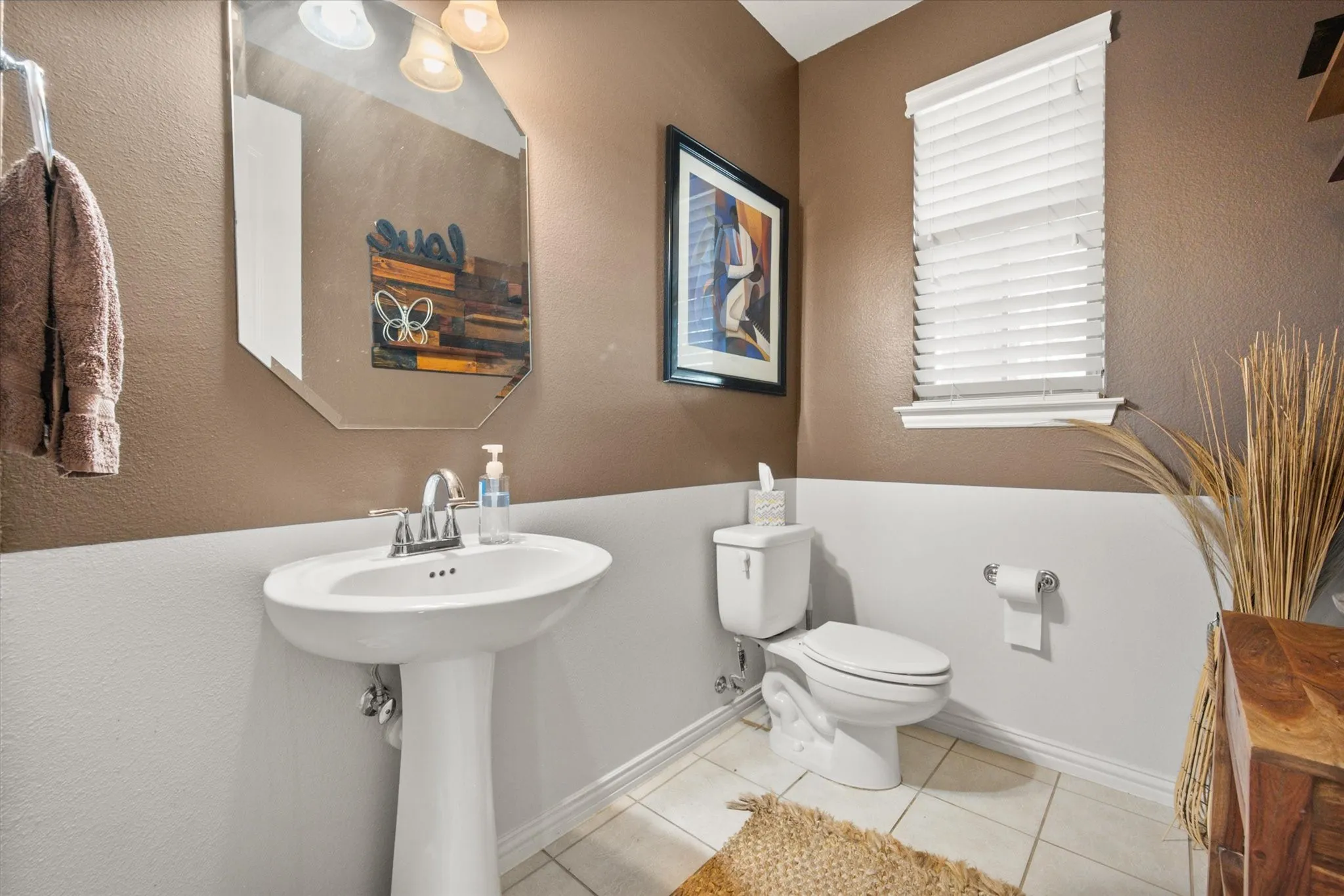 Half bathroom downstairs by the bonus room and office