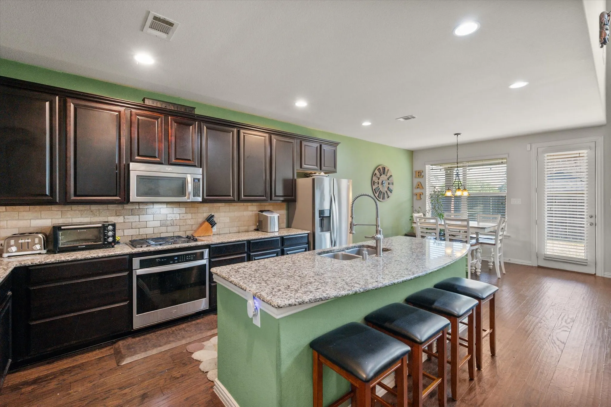 Kitchen open to the breakfast nook and dining room