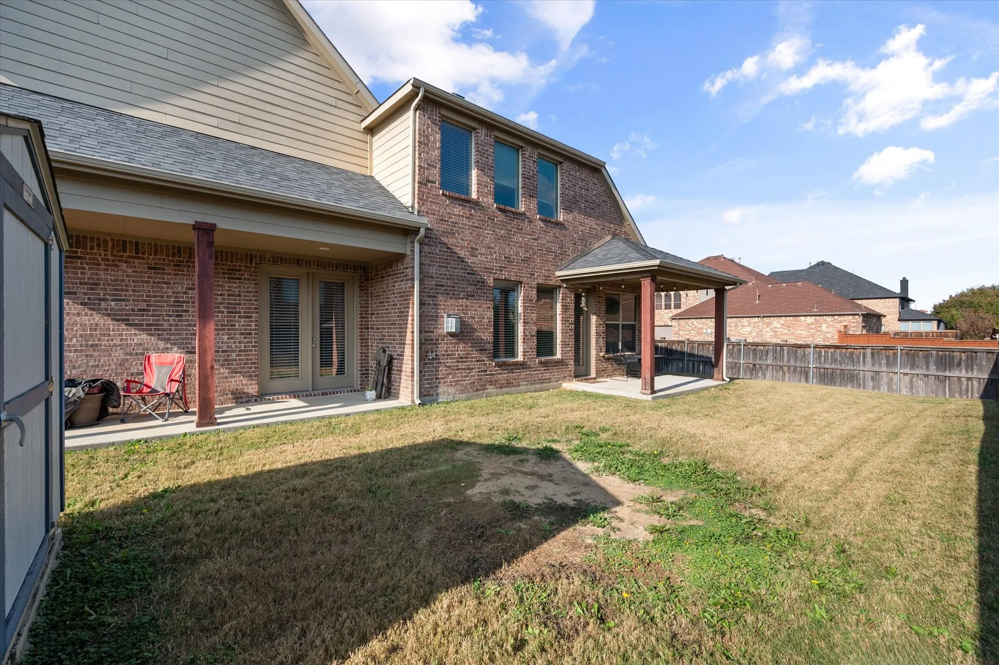 Yard large enough for a pool and 2 covered patios!