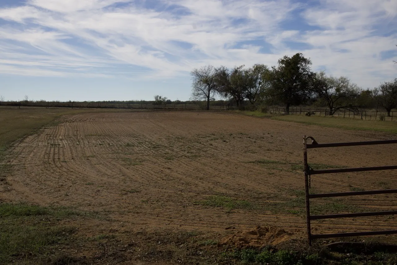 View of yard with a view of rural / pastoral area and an enclosed riding area