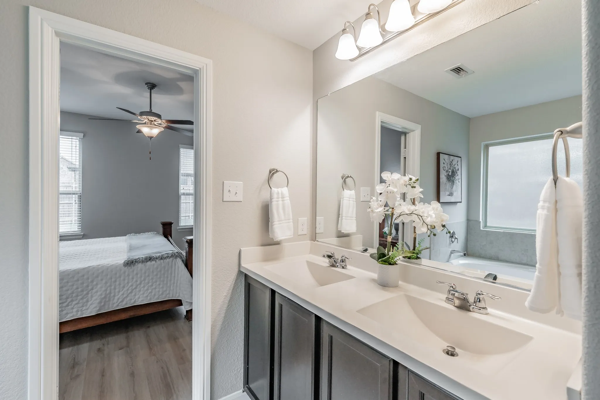 Primary Bayh with double vanity and separate shower.