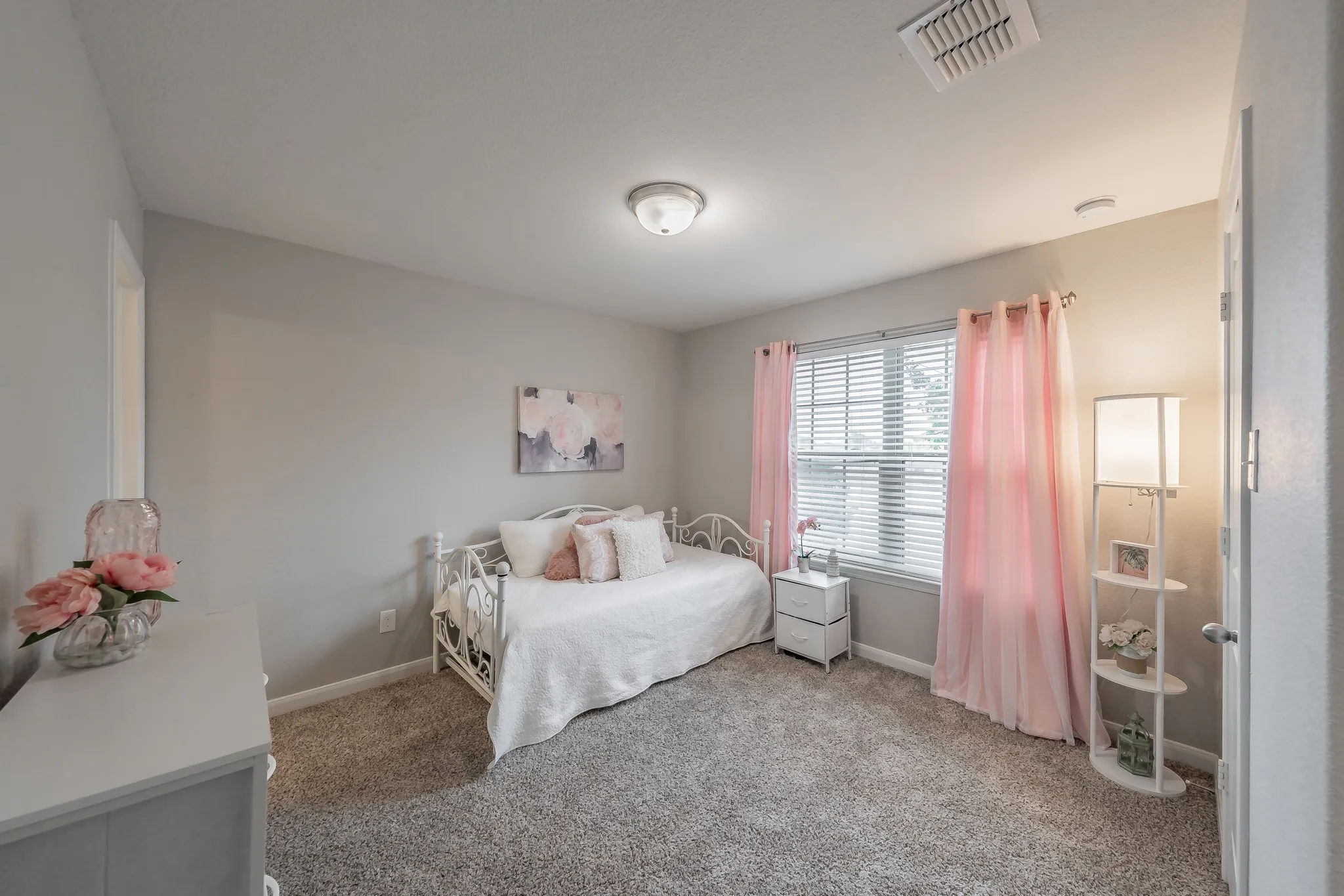 This bedroom has an ensuite bath and can be used as a second primary.
