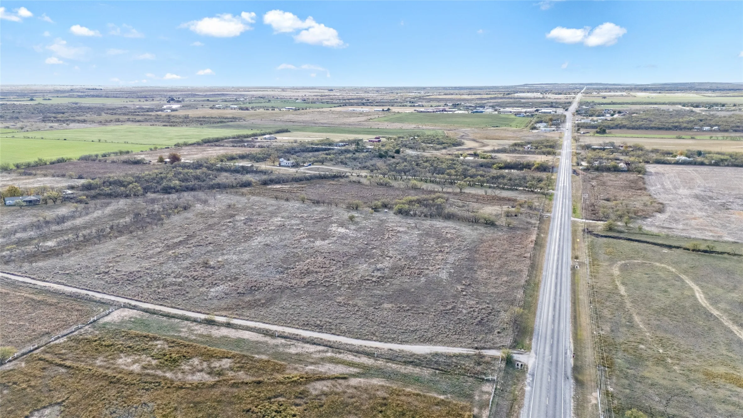 Aerial view of property and surrounding area with rural landscape