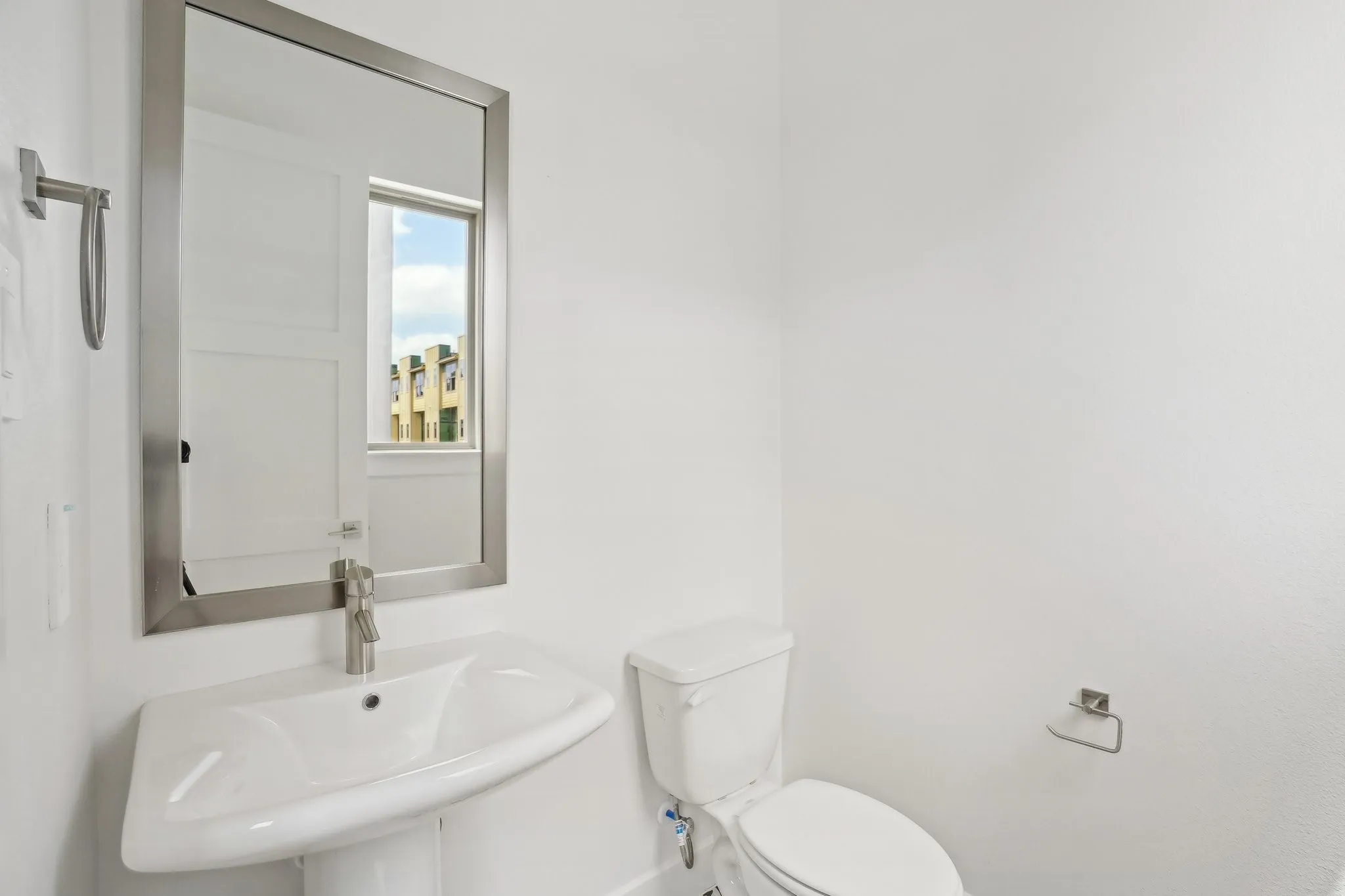 Half bathroom with a sink and toilet