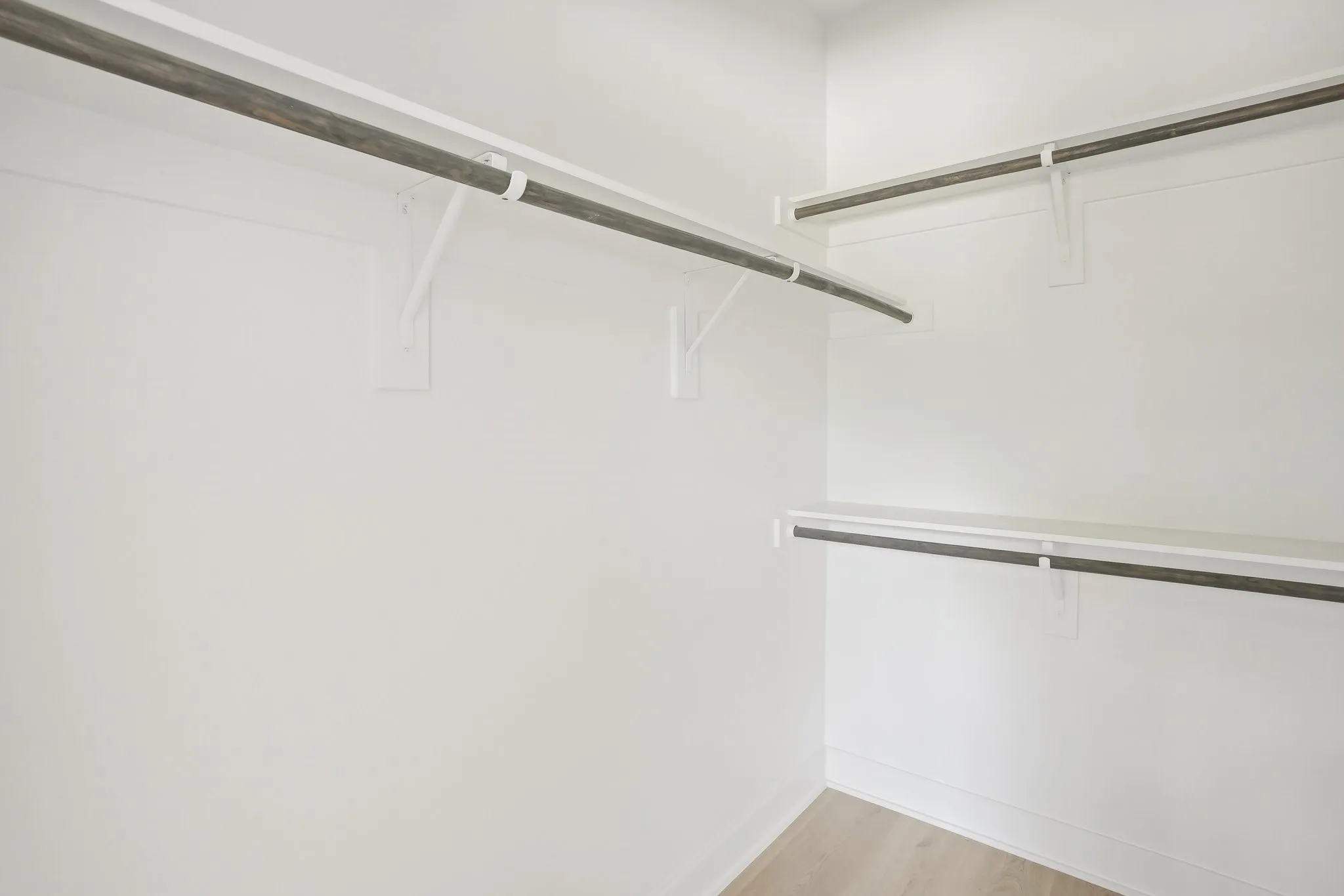Walk in closet featuring light wood-style floors