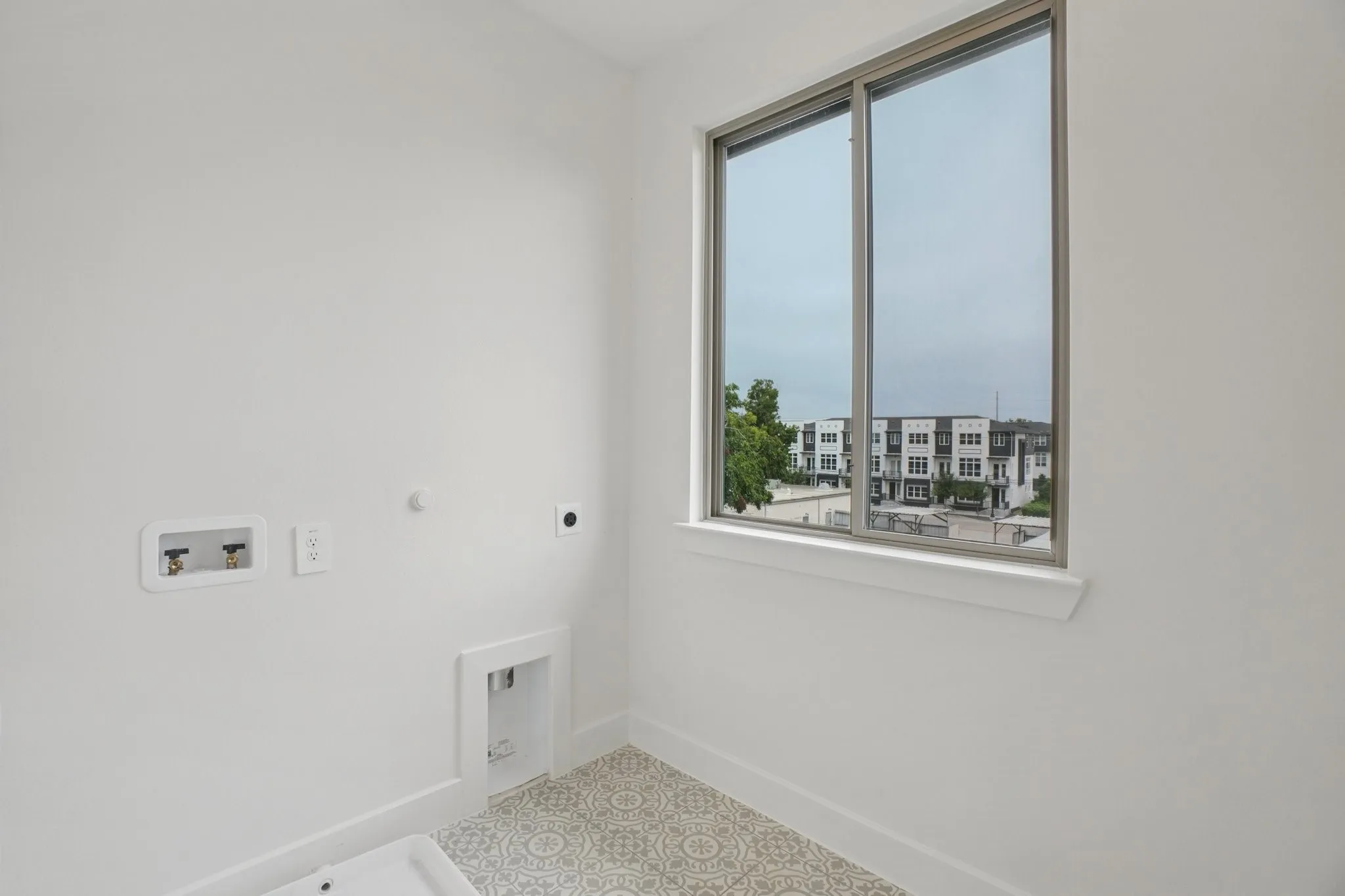 Washroom featuring hookup for a gas dryer, hookup for an electric dryer, and hookup for a washing machine