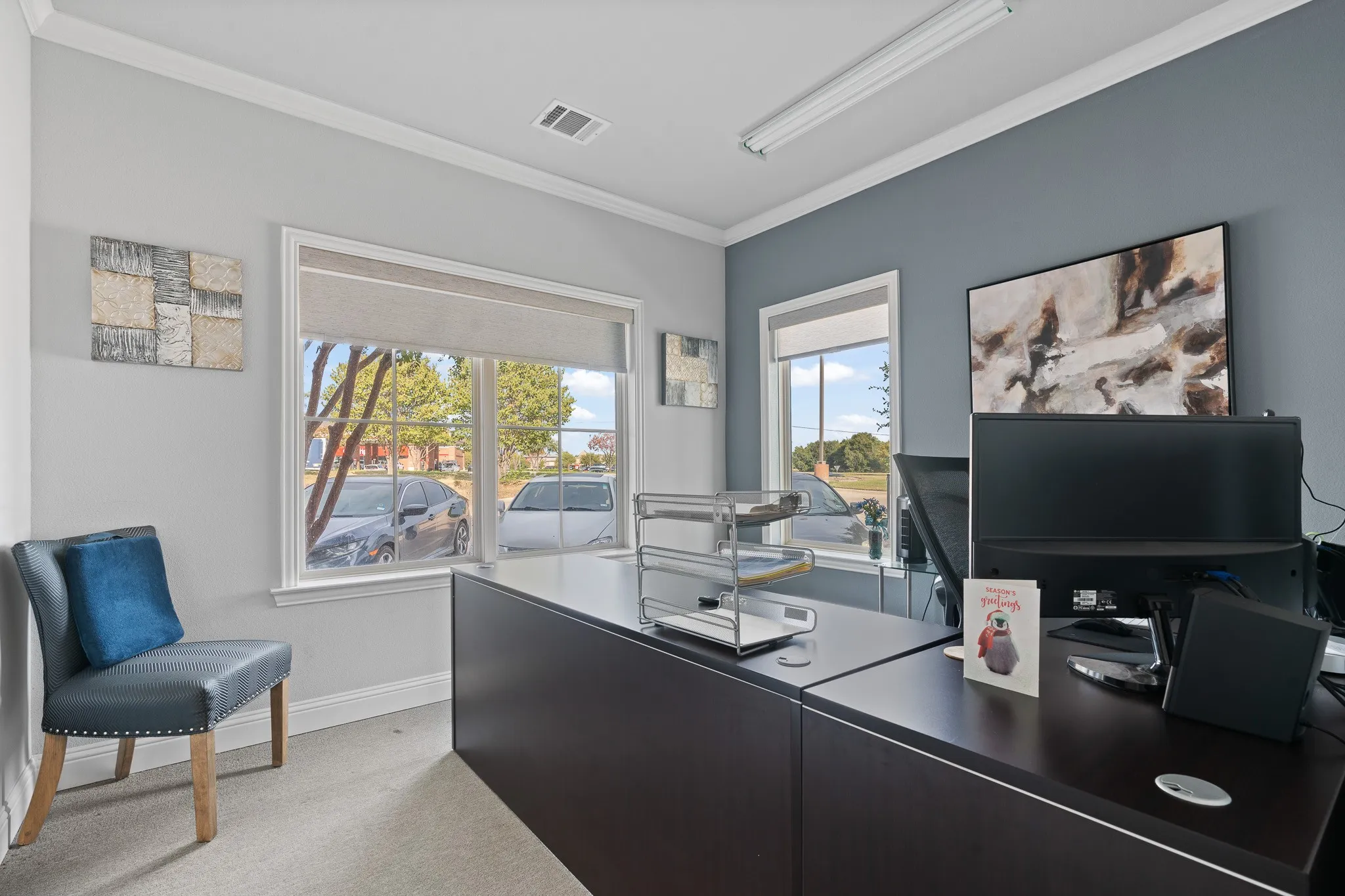 Front office good amount of natural light, overlooks front parking lot of building and Davis Blvd