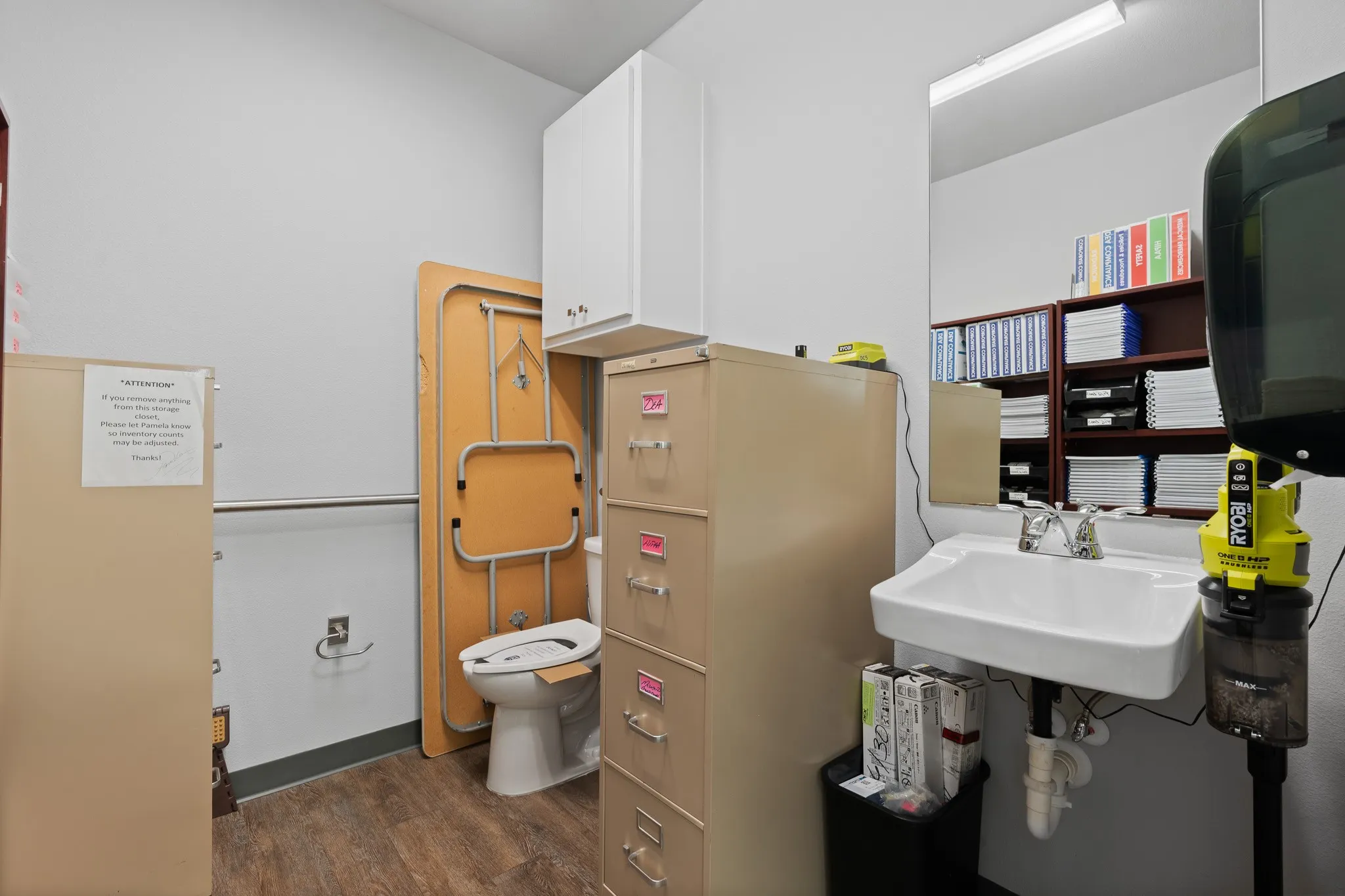 Middle bathroom in hallway and in between offices, ADA compliant