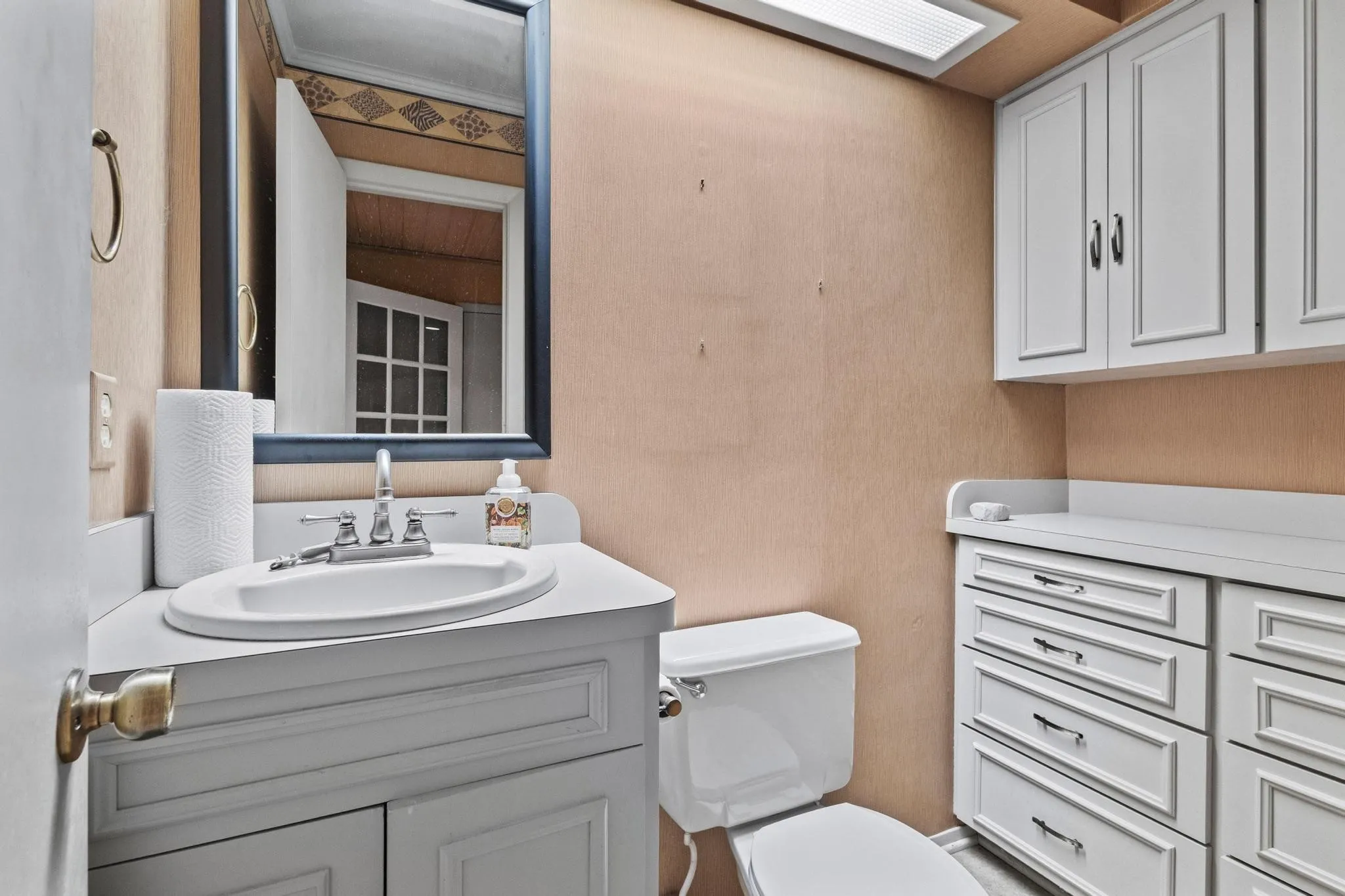 half bathroom downstairs by sunroom
