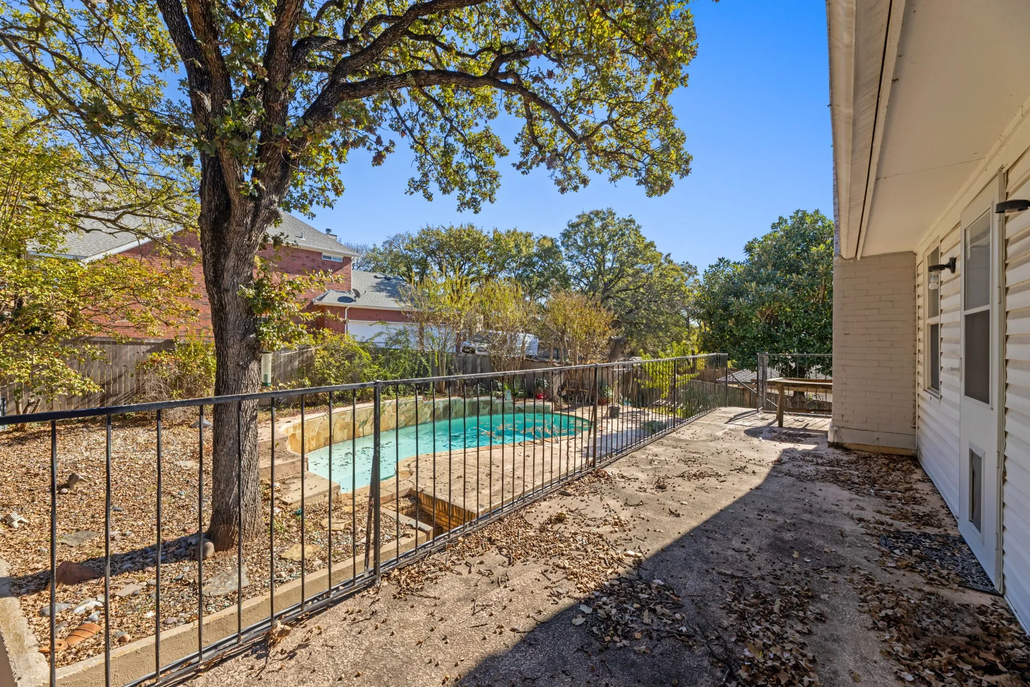 View of pool with a fenced backyard and a patio area