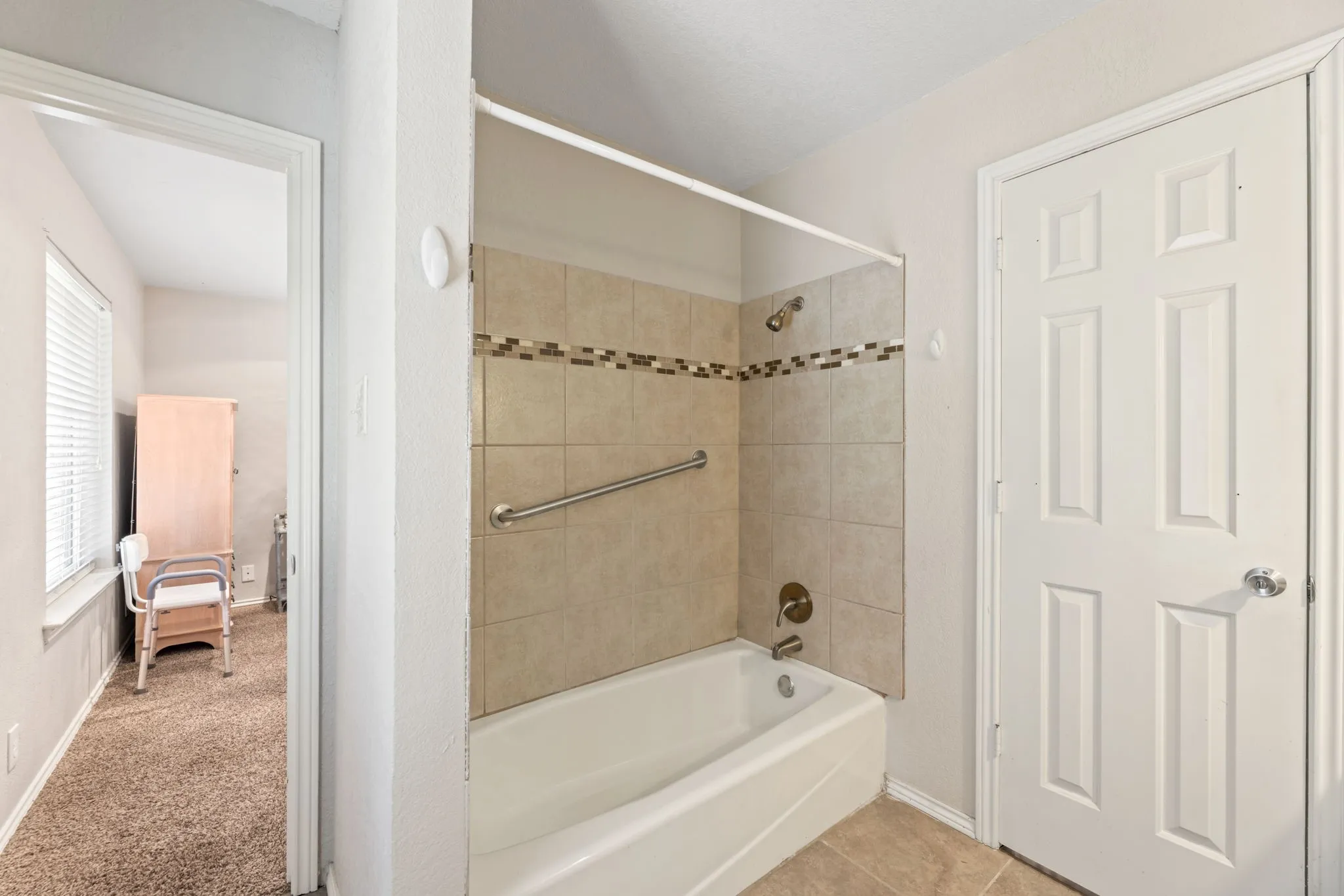 Full bath with shower / tub combination and carpet