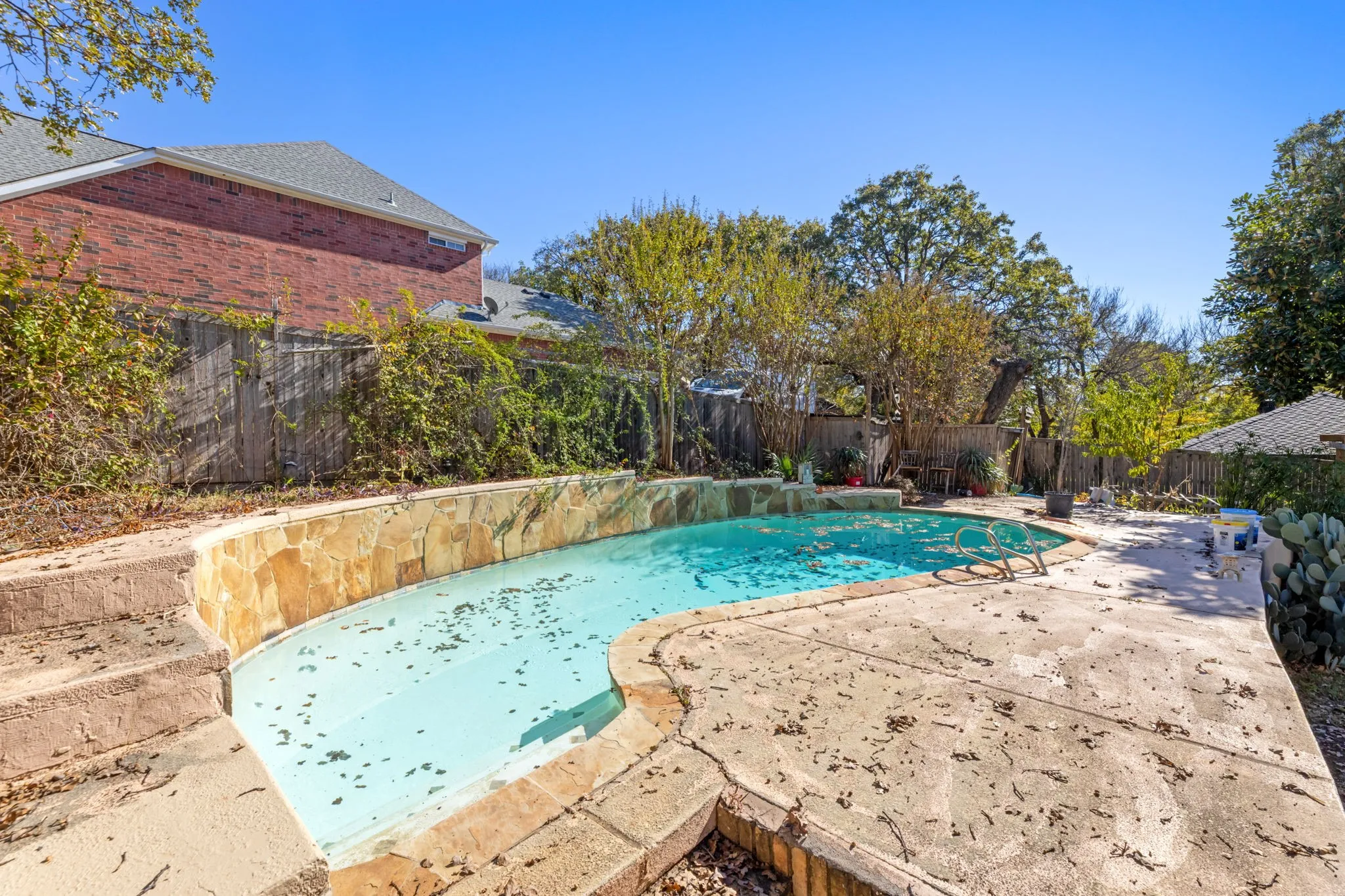View of pool featuring a fenced backyard and a patio area