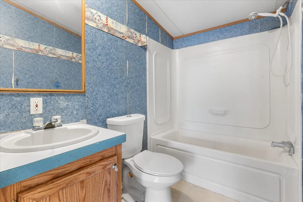 Full bathroom with vanity and shower / tub combination