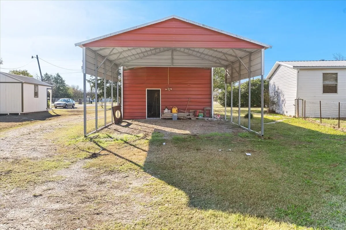 View of outbuilding with a carport
