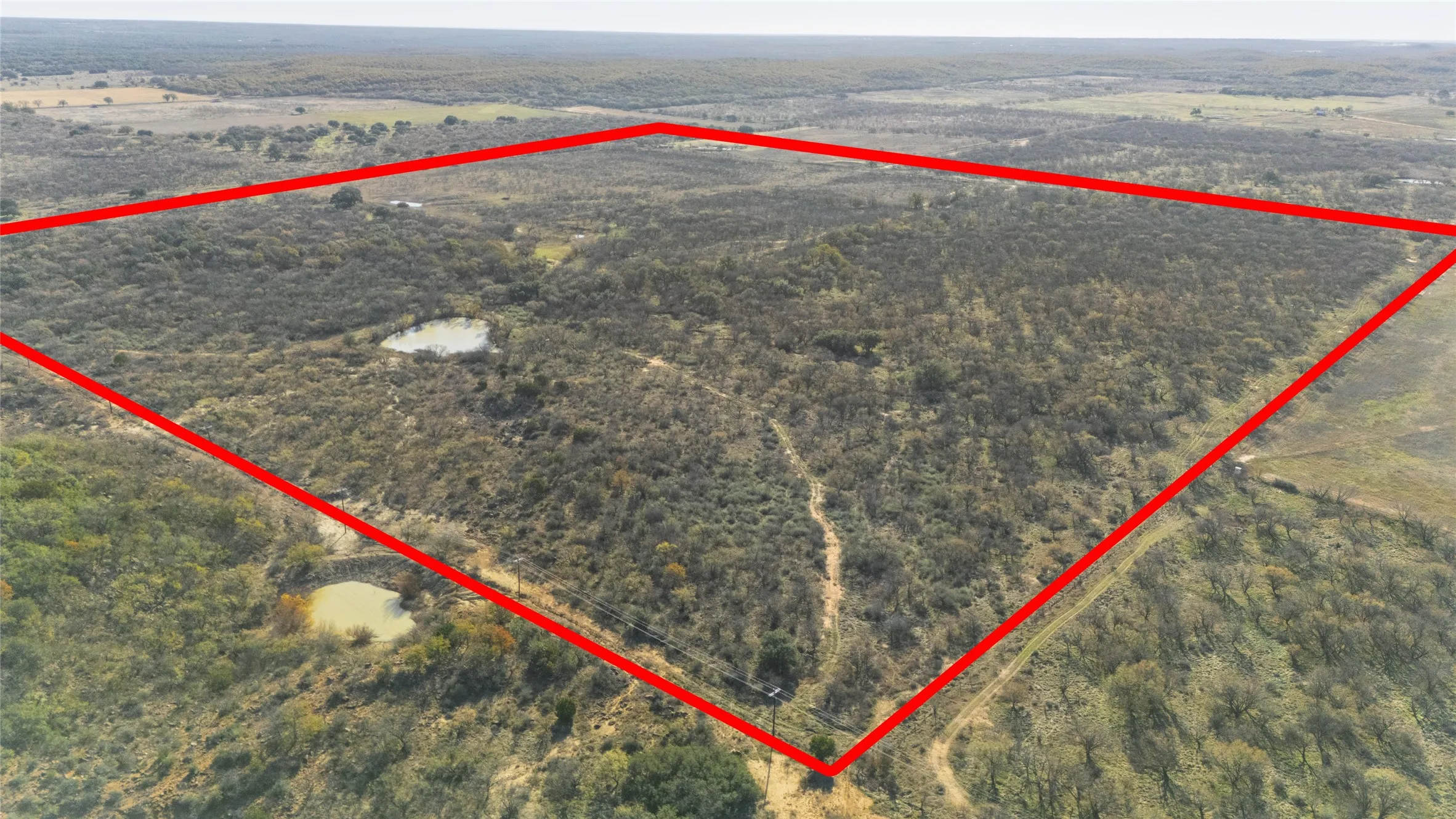 Overview of rural landscape featuring property parcel outlined