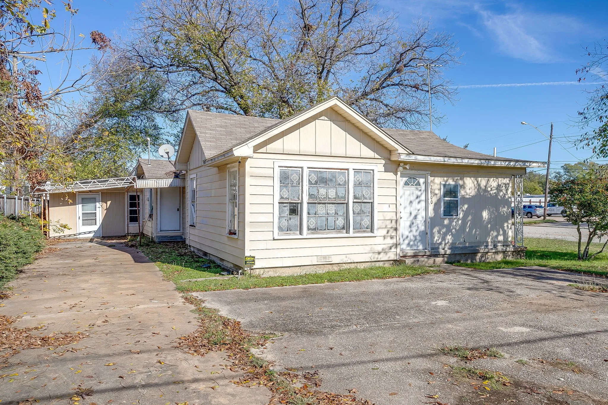View of front of property featuring roof with shingles and board and batten siding