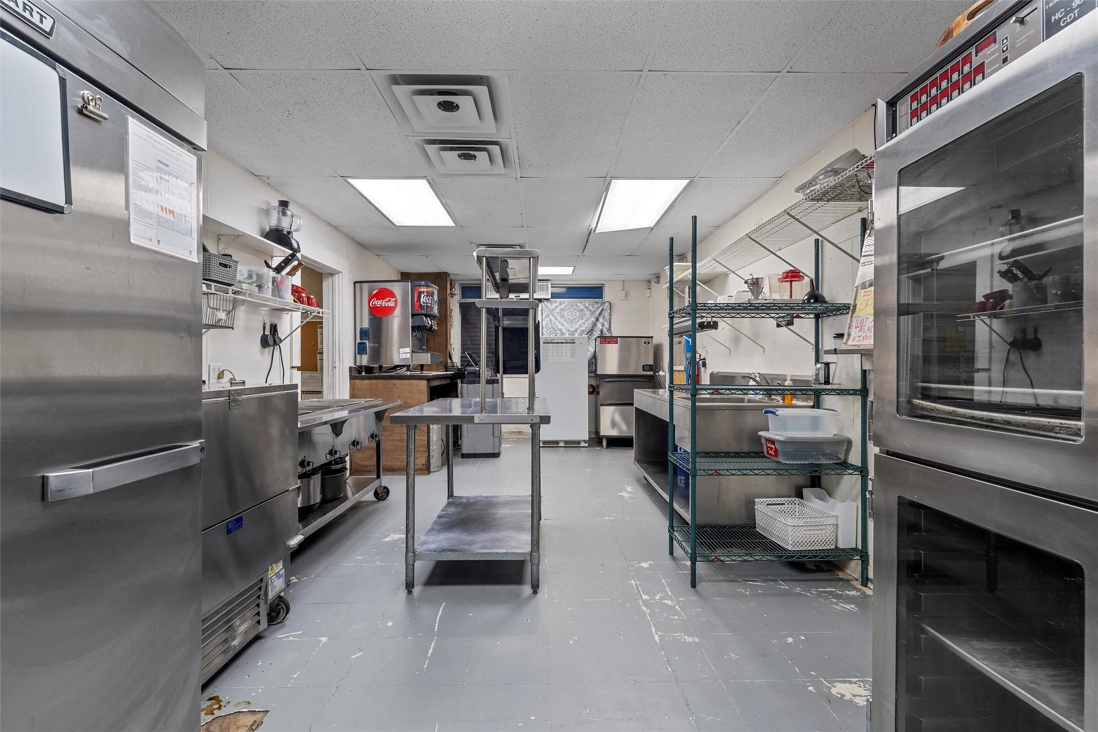 Kitchen with stainless steel appliances and a drop ceiling