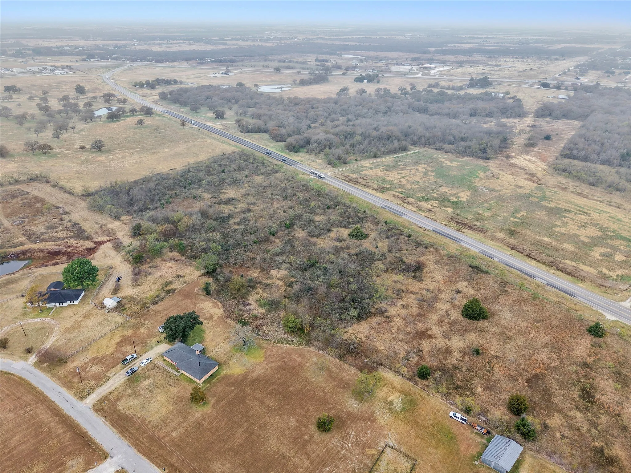 Aerial view of property and surrounding area with rural landscape
