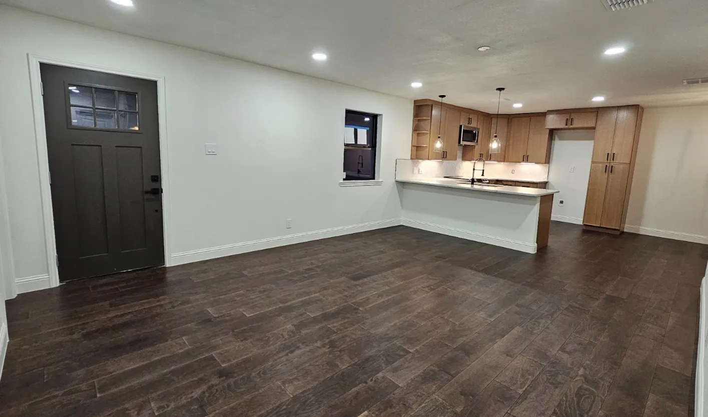 Kitchen featuring a peninsula, pendant lighting, recessed lighting, light countertops, and open floor plan
