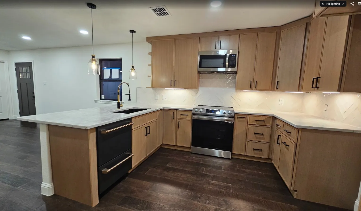 Kitchen with dark wood-style floors, stainless steel appliances, recessed lighting, pendant lighting, and a peninsula